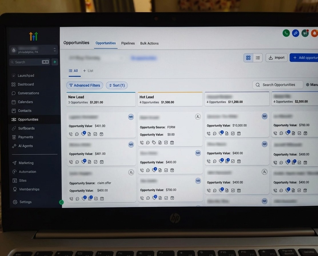 Laptop screen displaying a dashboard with opportunity data, filters, and navigation menu on the left side.