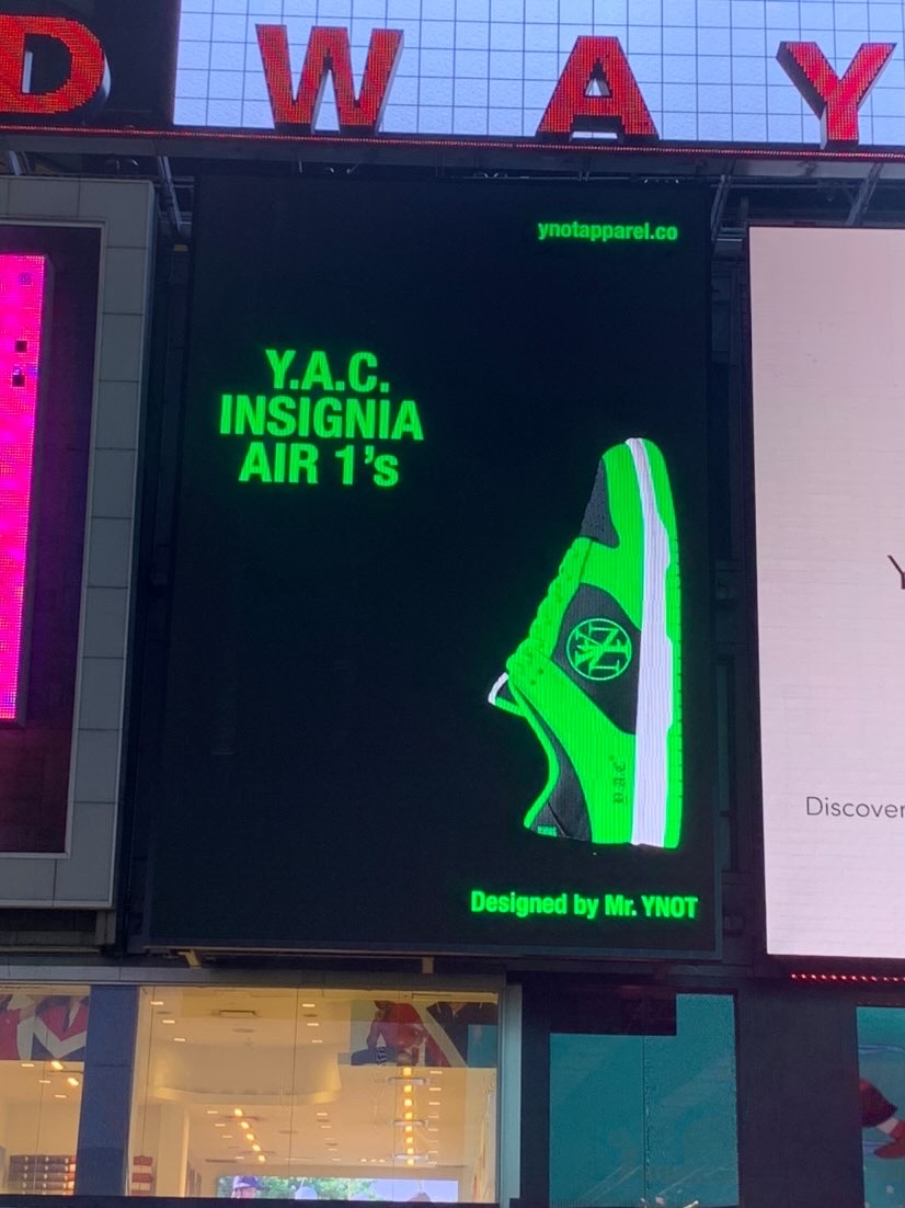 Digital display shows a green sneaker illustration and text about Y.A.C. Insignia Air 1's, designed by Mr. TIVOT.