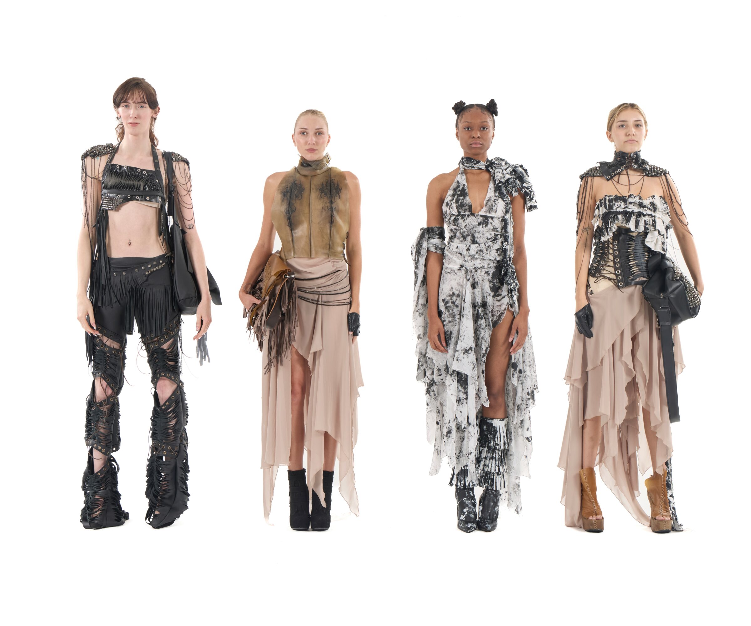 Four models in high fashion outfits pose against a white background.