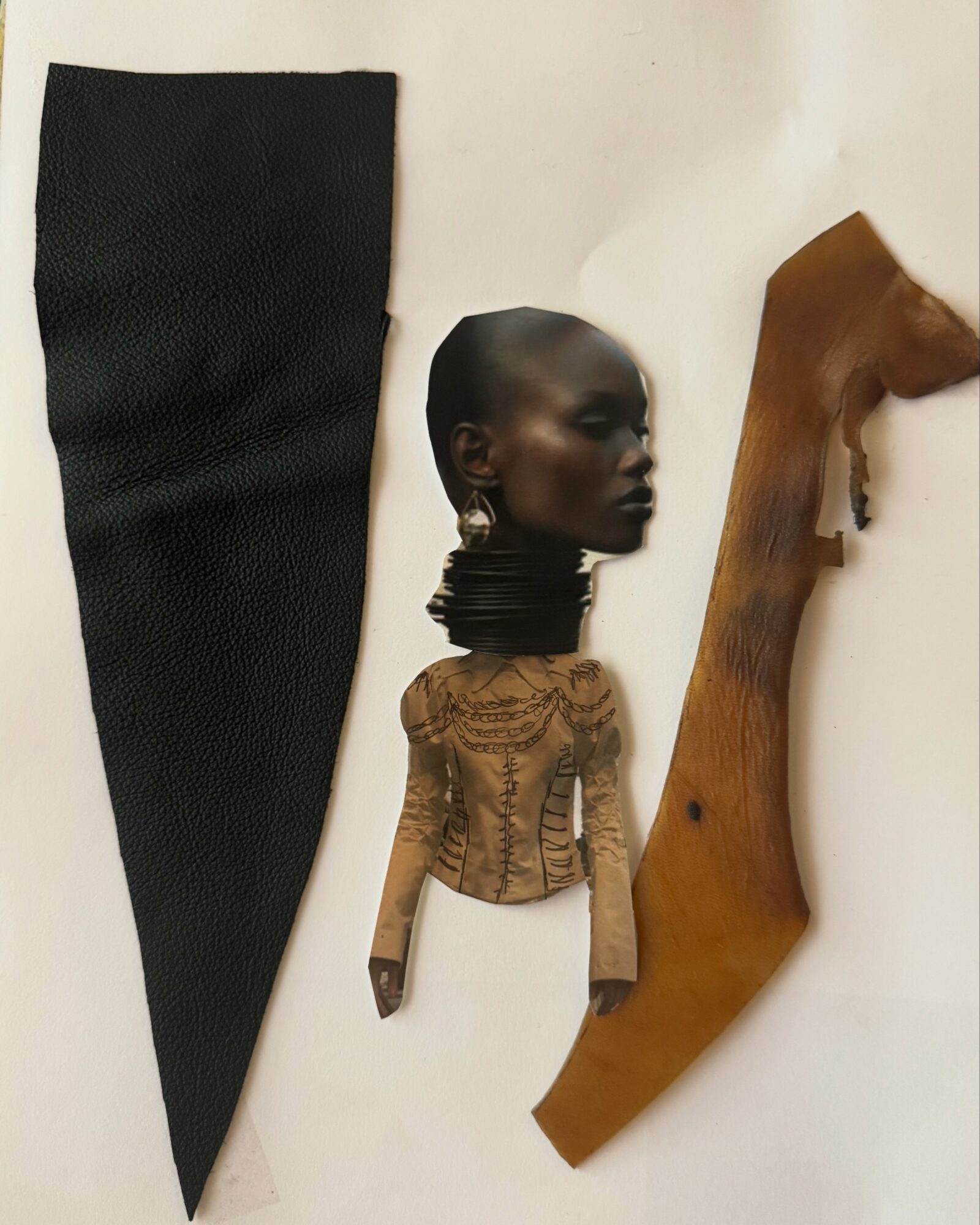 Artistic collage with a black textured fabric, a dark-skinned woman with jewelry, and a curved wooden piece.