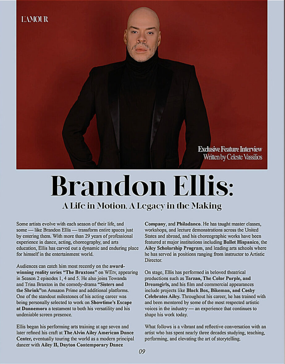 Brandon Ellis in a black suit with a red background, looking directly at the camera.