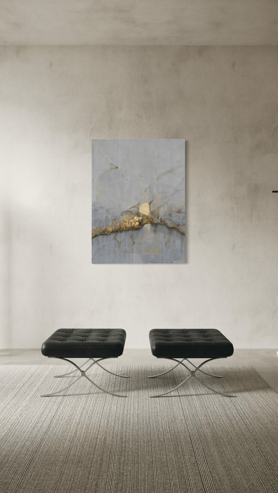 Two black cushioned stools with metal legs in front of a plain wall with a painting above them.
