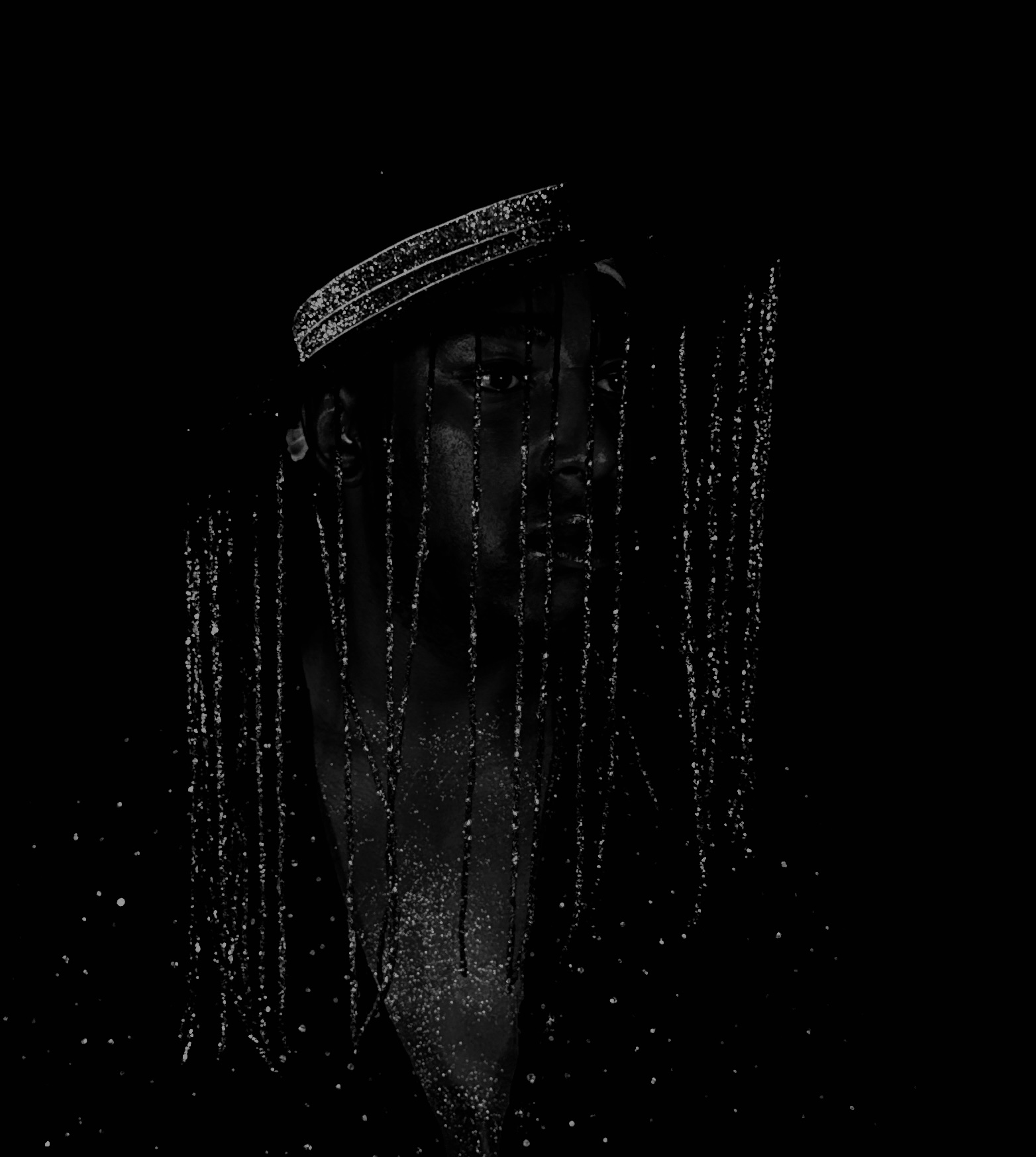 Person wearing a hat with hanging beads or chains, face partially visible in dark lighting.