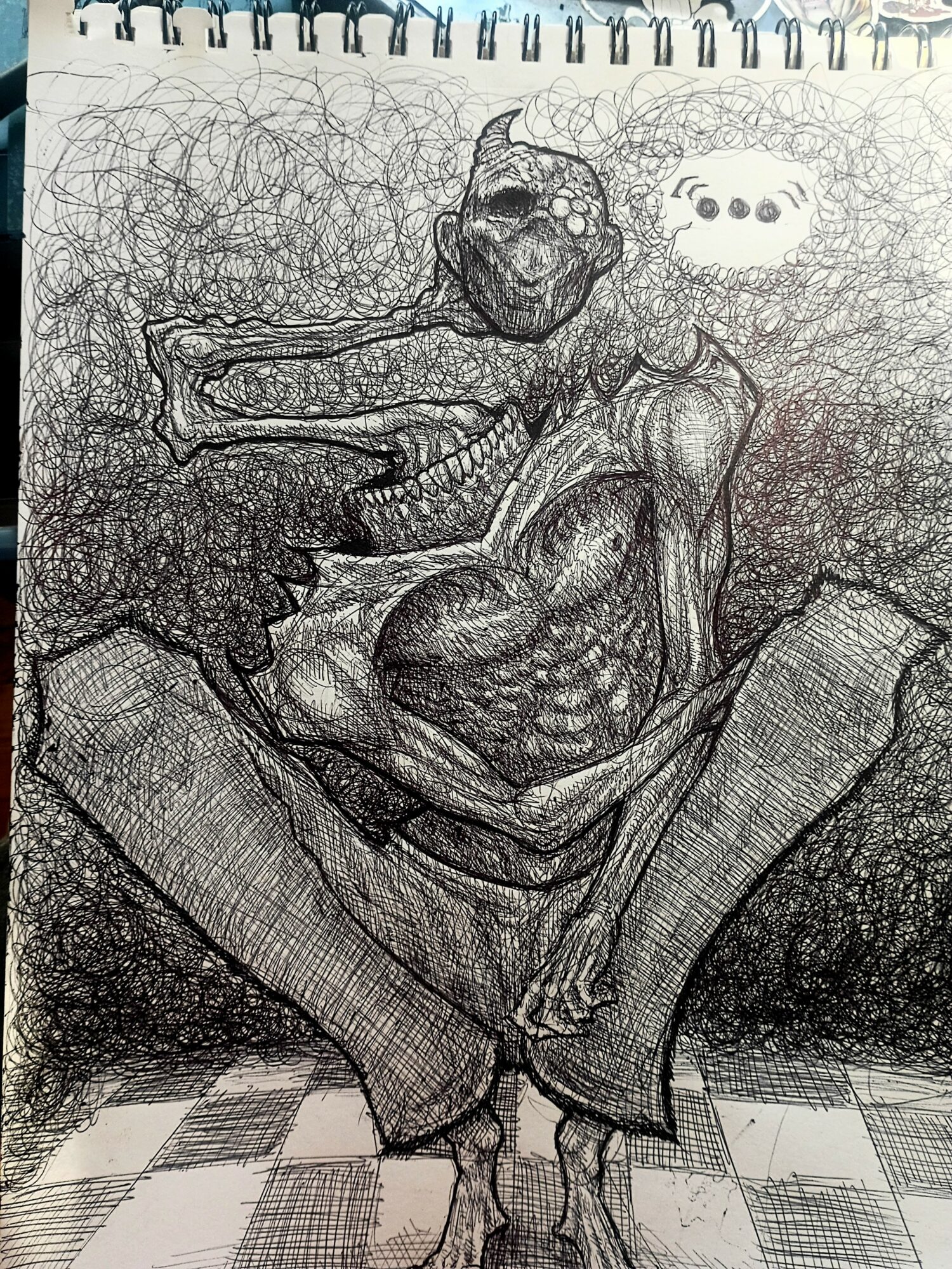 Sketch of a humanoid figure with exaggerated muscles, sitting cross-legged with a speech bubble containing three dots.