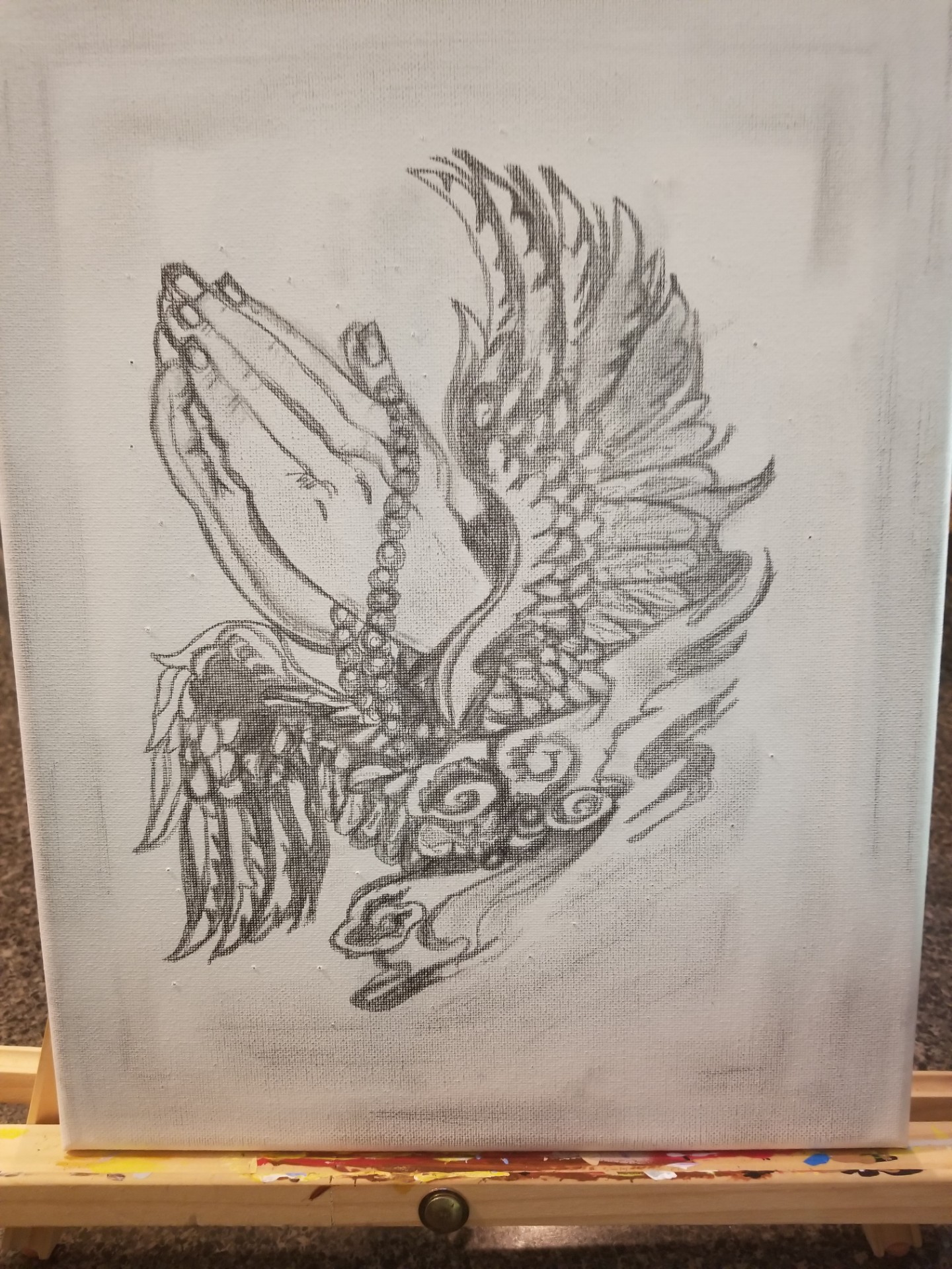 Sketch of a bird with wings spread, holding prayer beads in its beak, detailed feathers and swirling patterns.