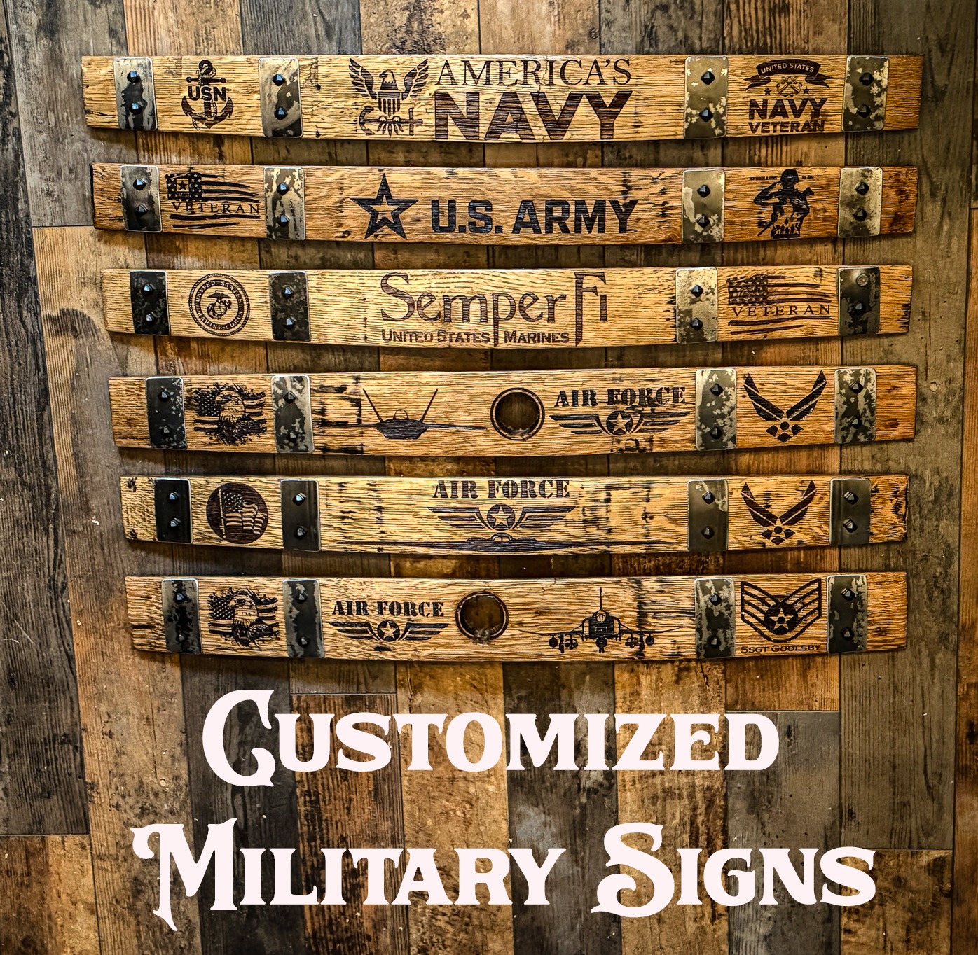 Six wooden military signs with various insignias and texts, arranged vertically on a wooden background.