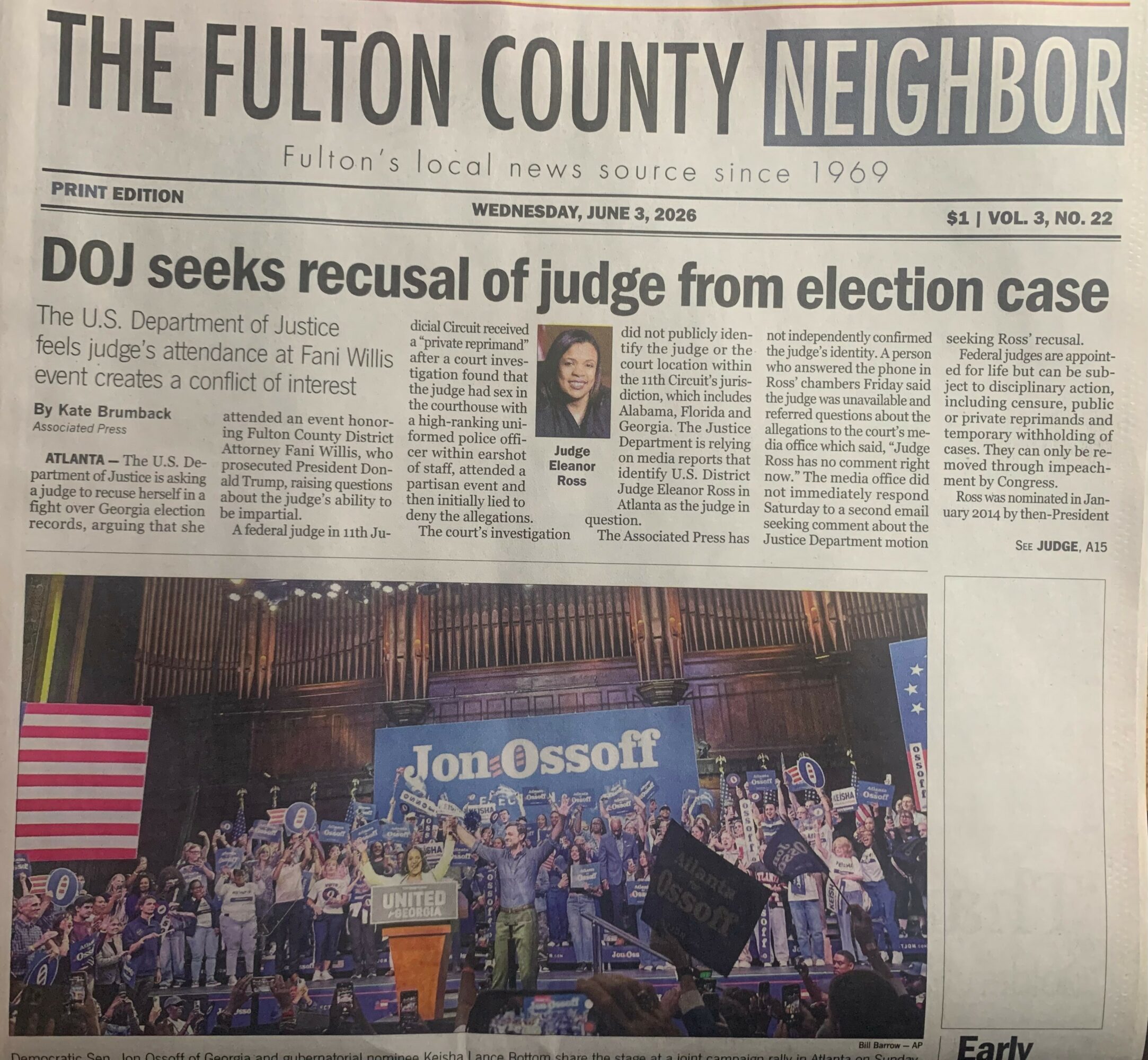 Newspaper front page with headline about judge from election case and a photo of a large outdoor concert with a stage and crowd.