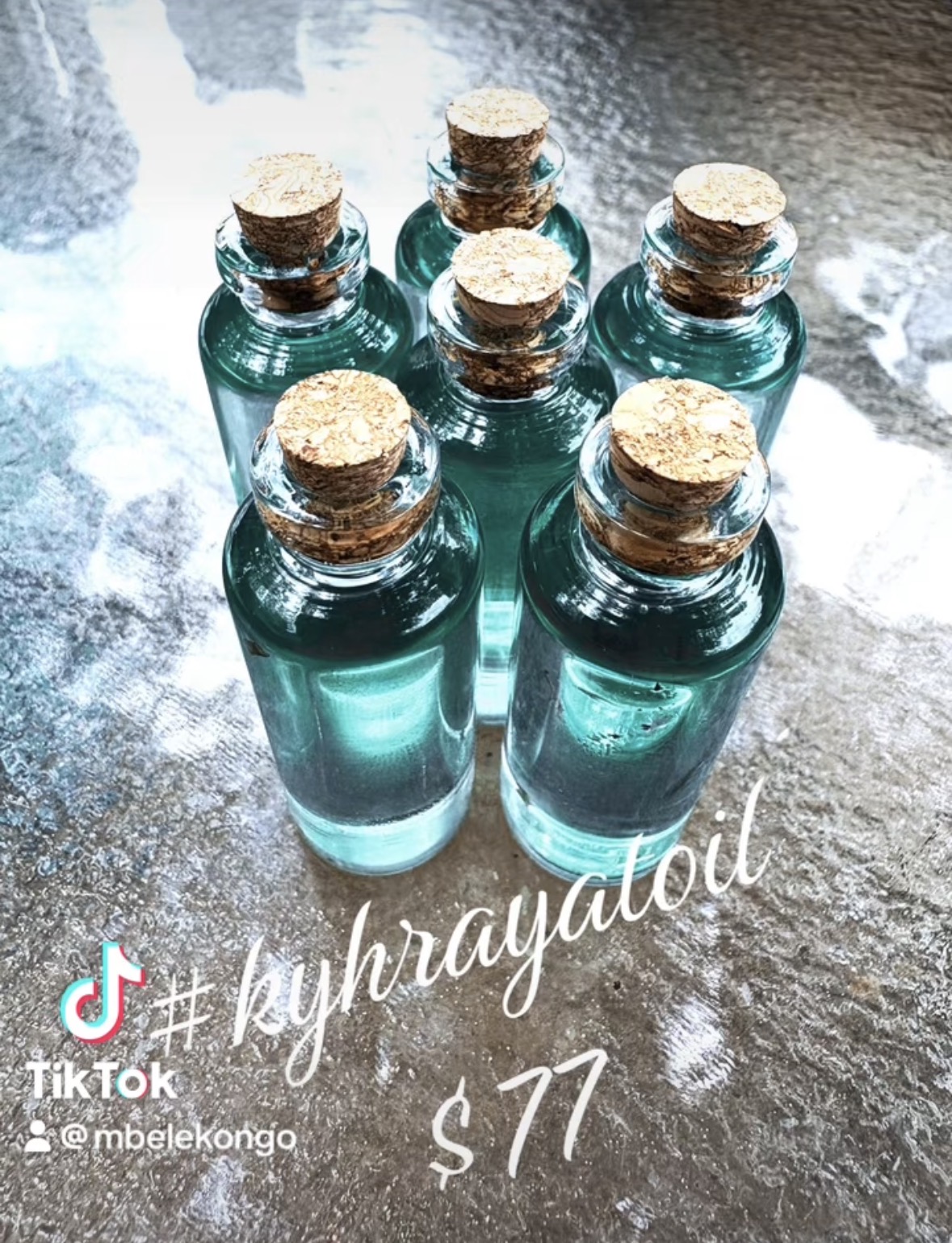 Seven small glass bottles with cork stoppers arranged on a reflective surface, with handwritten text and a TikTok logo.