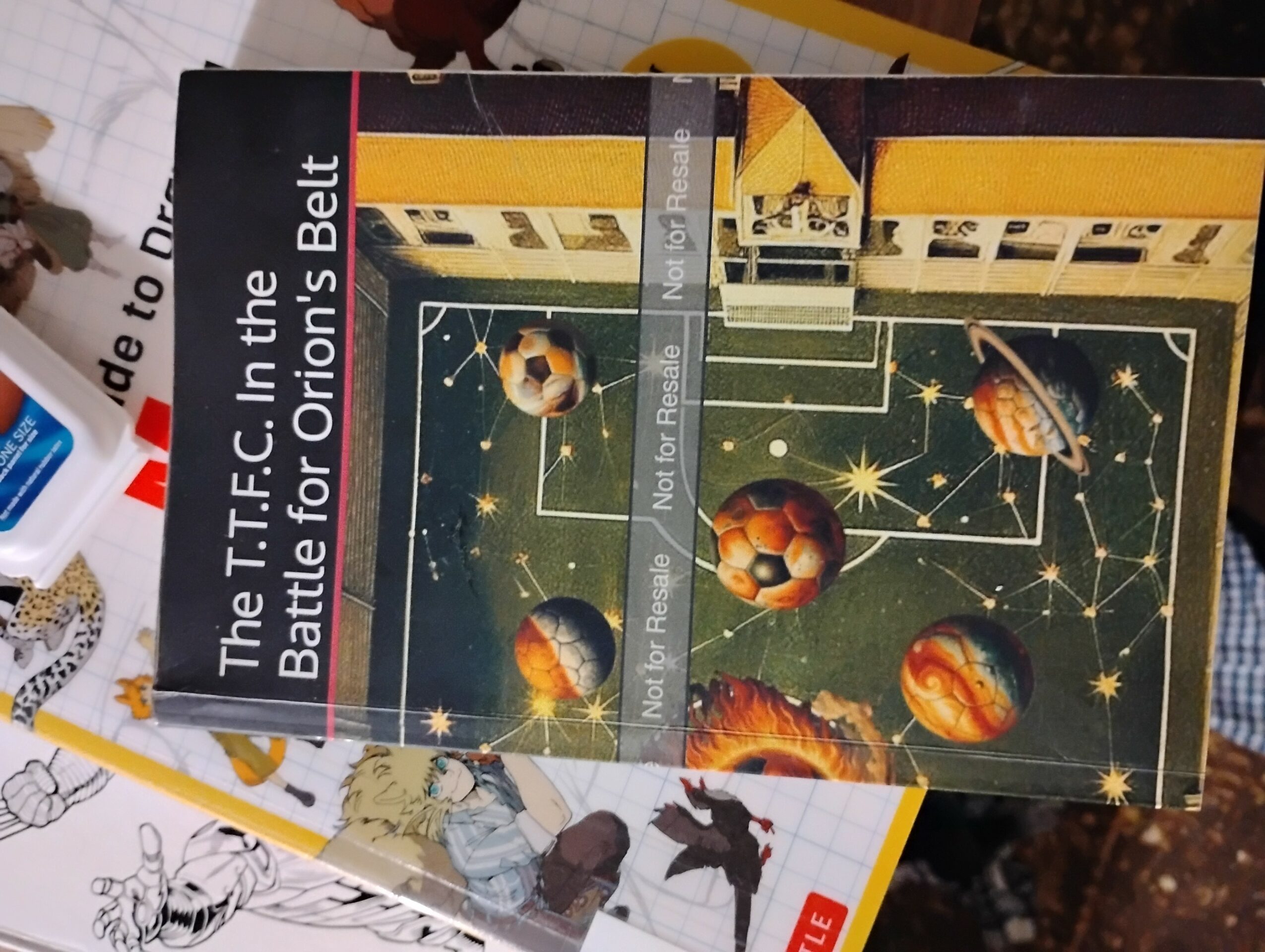 Book cover titled 'The T.F.C. In the Battle for Orion's Belt' with a space-themed illustration of planets and stars.