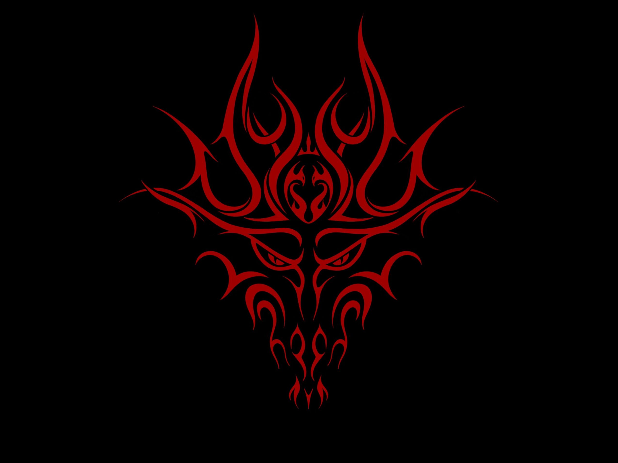 Red tribal-style design resembling a face or creature on black background.