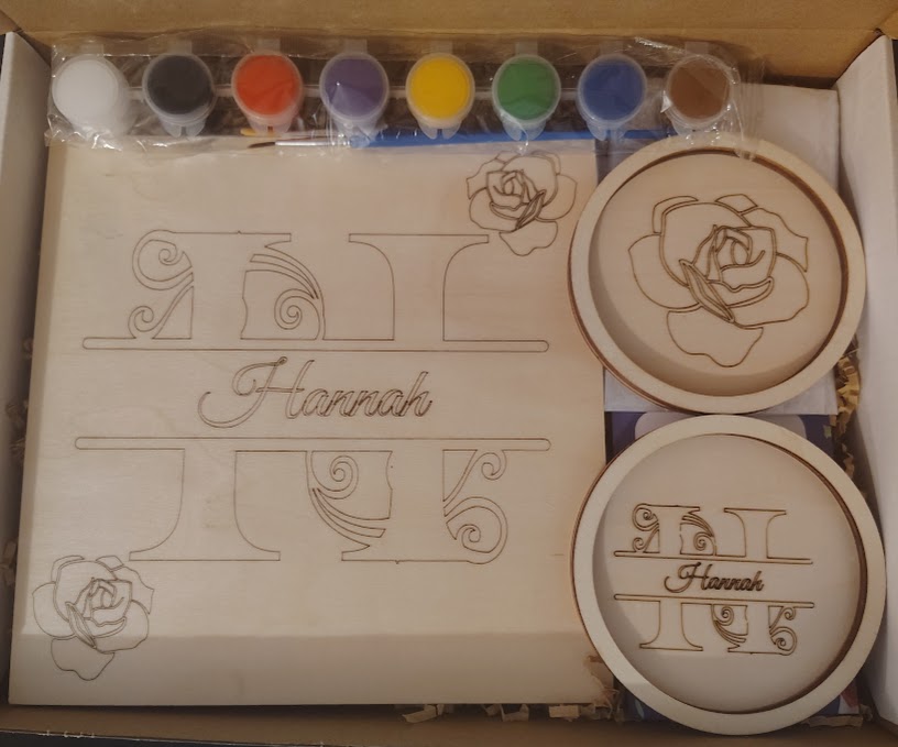Set of stamps with floral and decorative designs, including two round stamps with floral patterns, and a sheet with sketches and the word 'Harmas'.