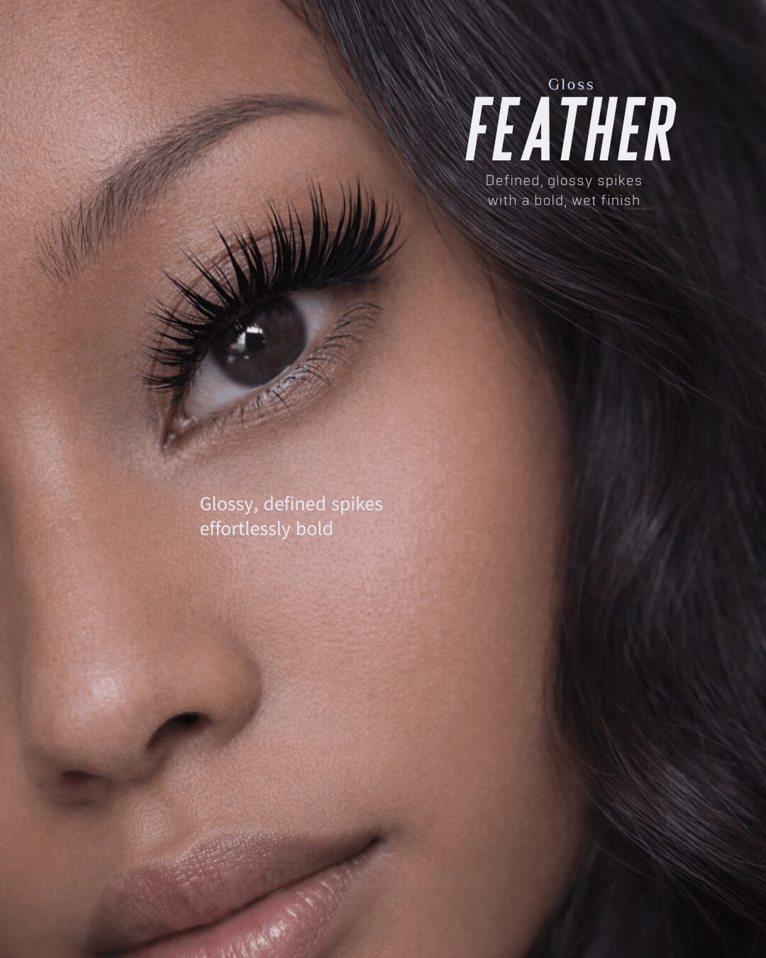 Close-up of a woman's eye with long, defined eyelashes and smooth skin, with text about feathered eyelashes.