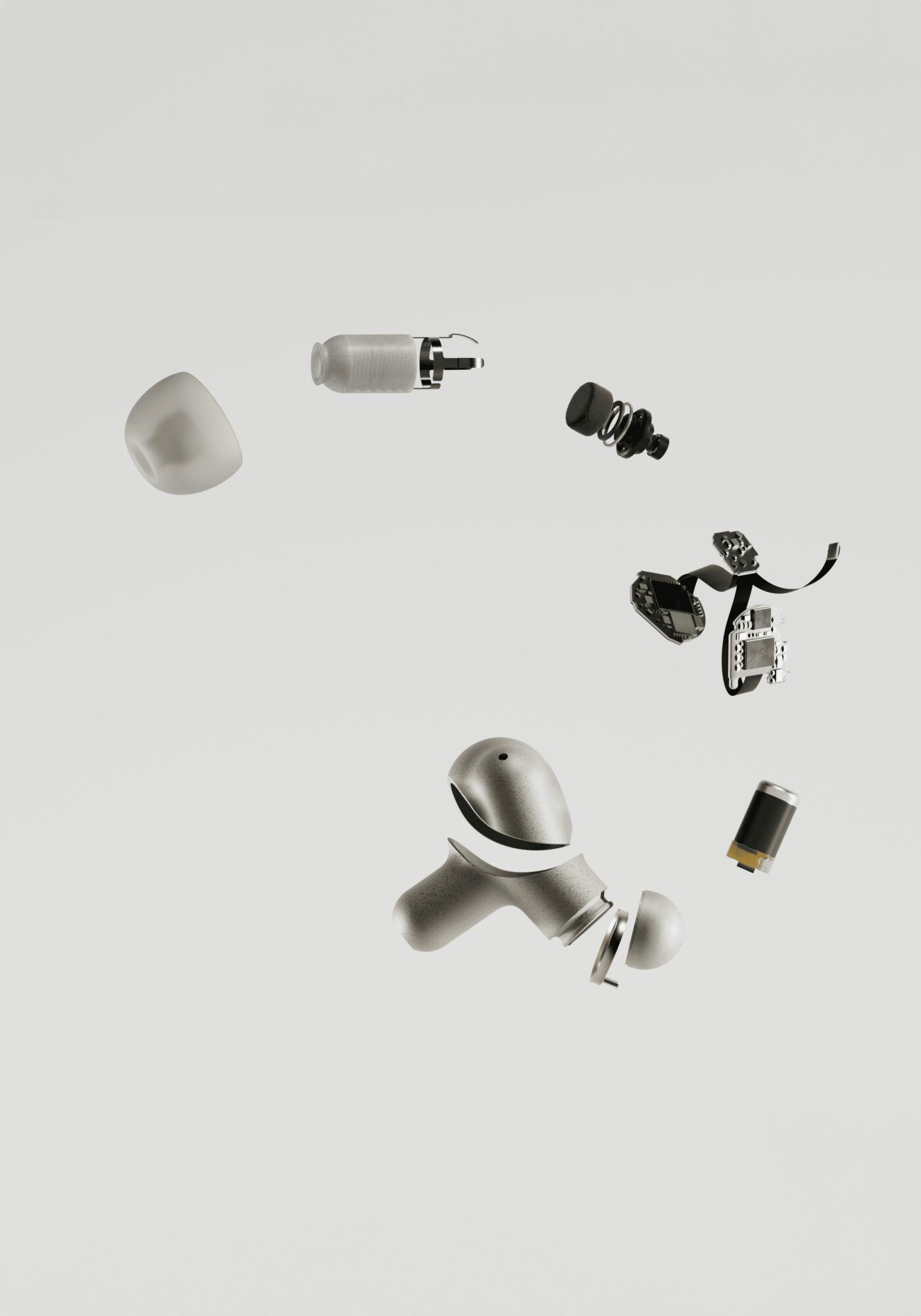 Disassembled wireless earbud components including ear tip, internal parts, and charging case, arranged on a white background.