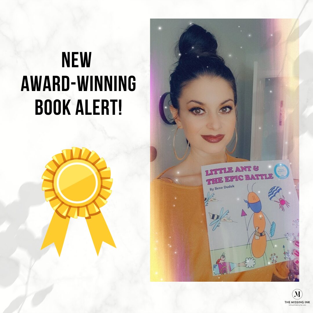 Woman with dark hair in a bun holding a colorful book titled 'Little Ant & The Epic Battle' with a smiling face, against a light background.