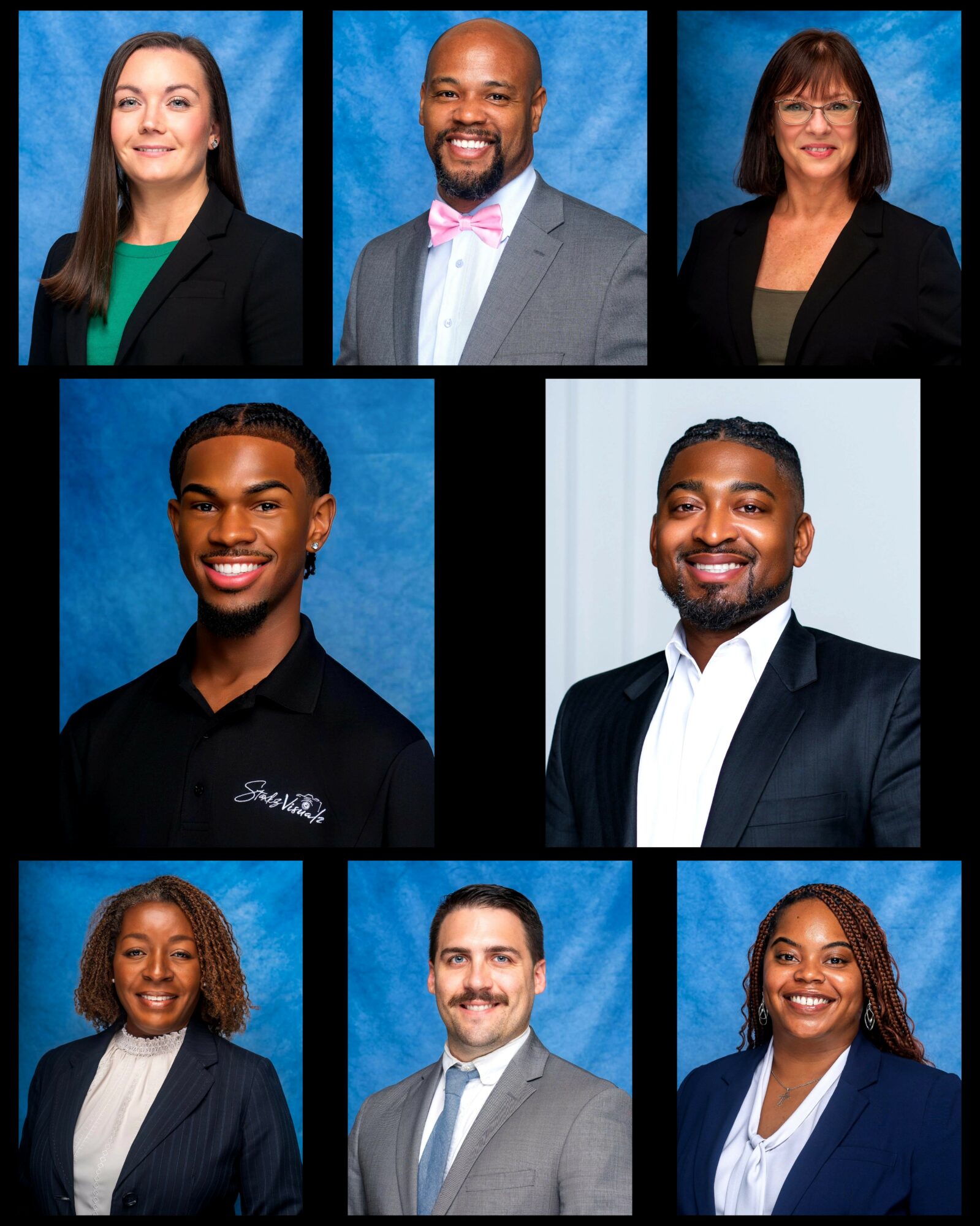 Group of nine diverse professionals in formal attire, smiling, against blue and white backgrounds.