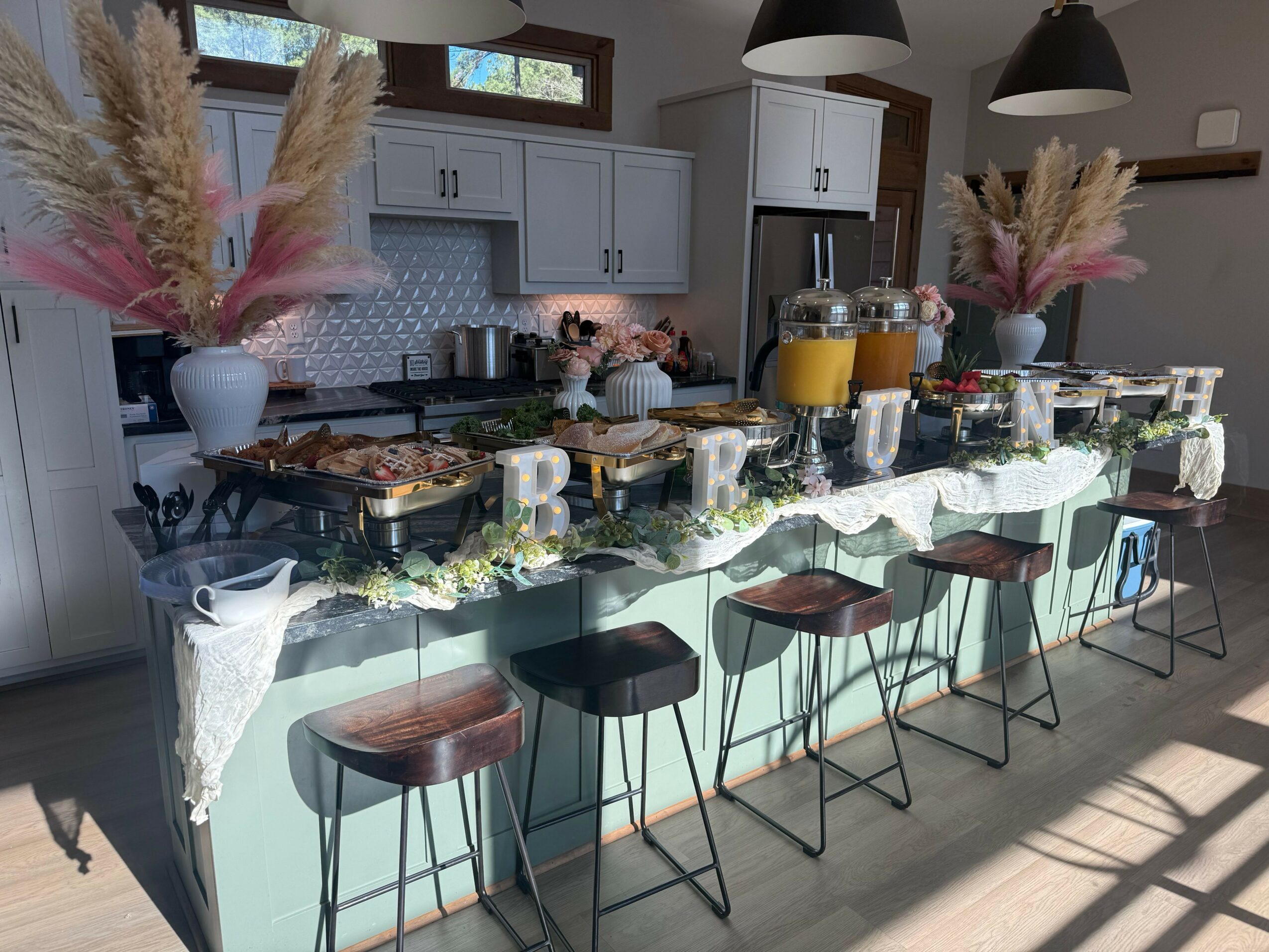 Hanging pots and pans above a kitchen counter with cabinets, plants, and decorative items, upside down.