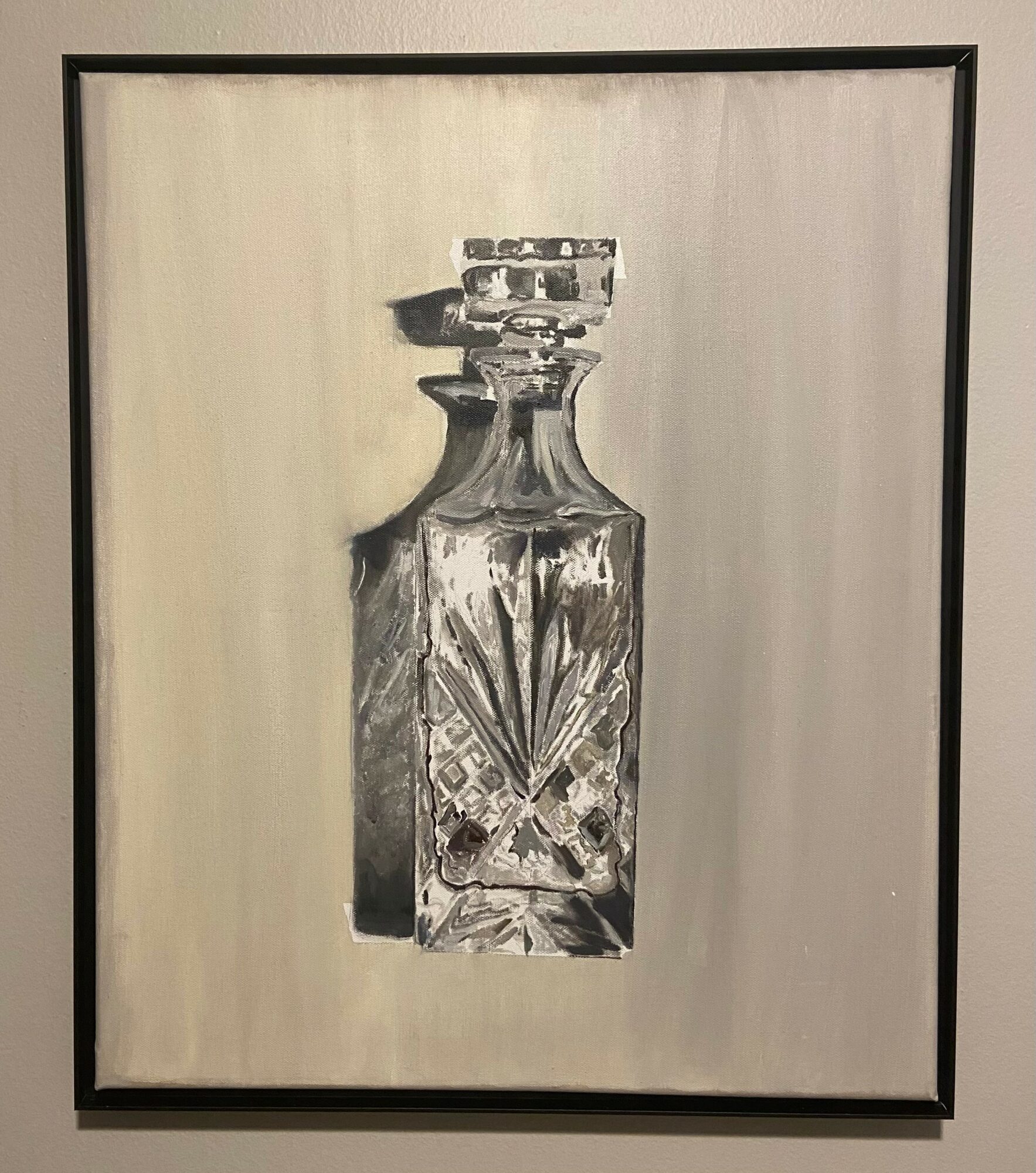 Painting of a glass bottle with a decorative pattern, framed and hung on a wall.