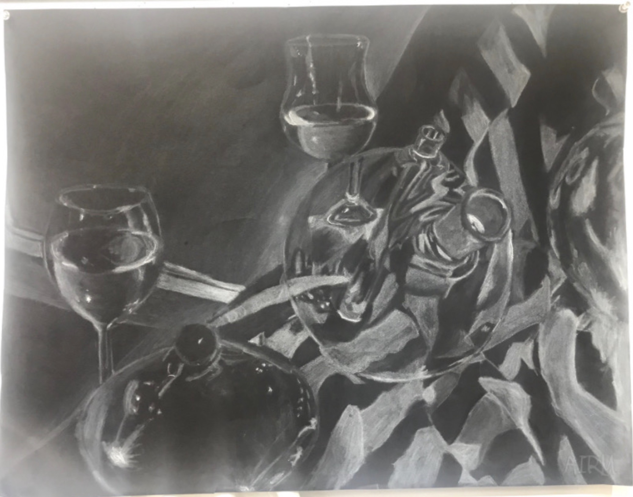 Two glasses of wine, a bottle, and a striped cloth on a table, in black and white.