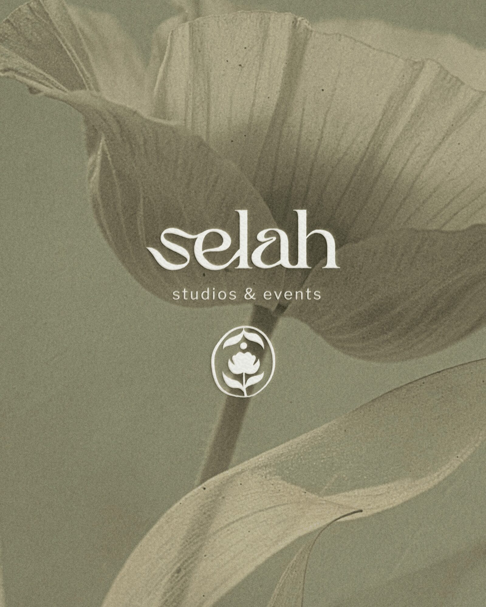 Close-up of a flower with text 'selah studios & events' and a logo, in muted green tones.
