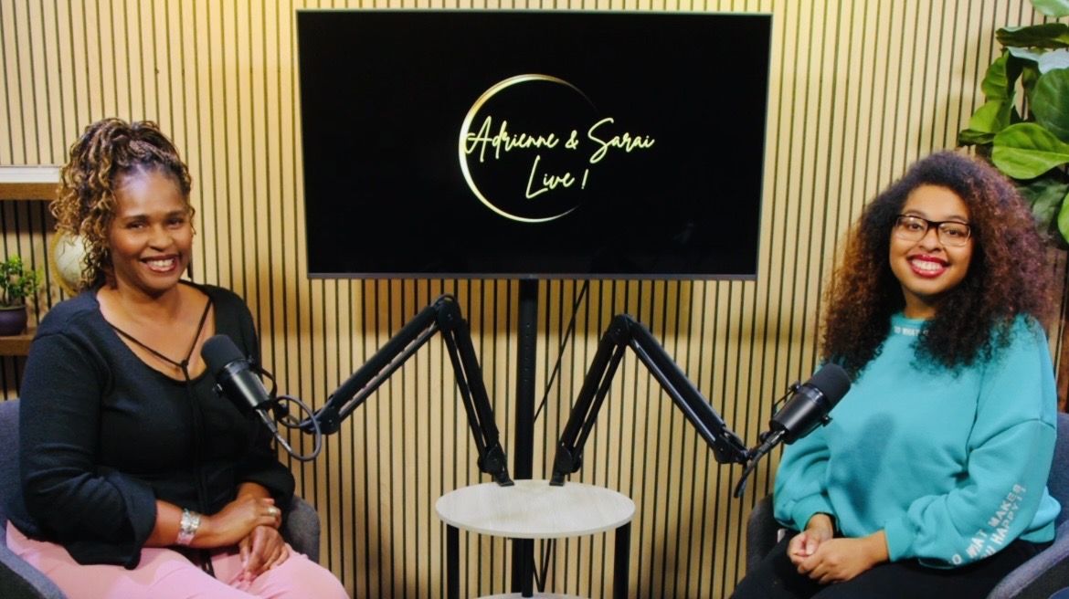 Two women sit in front of microphones in a recording studio with a screen displaying 'Aphene & Sanu Live'.