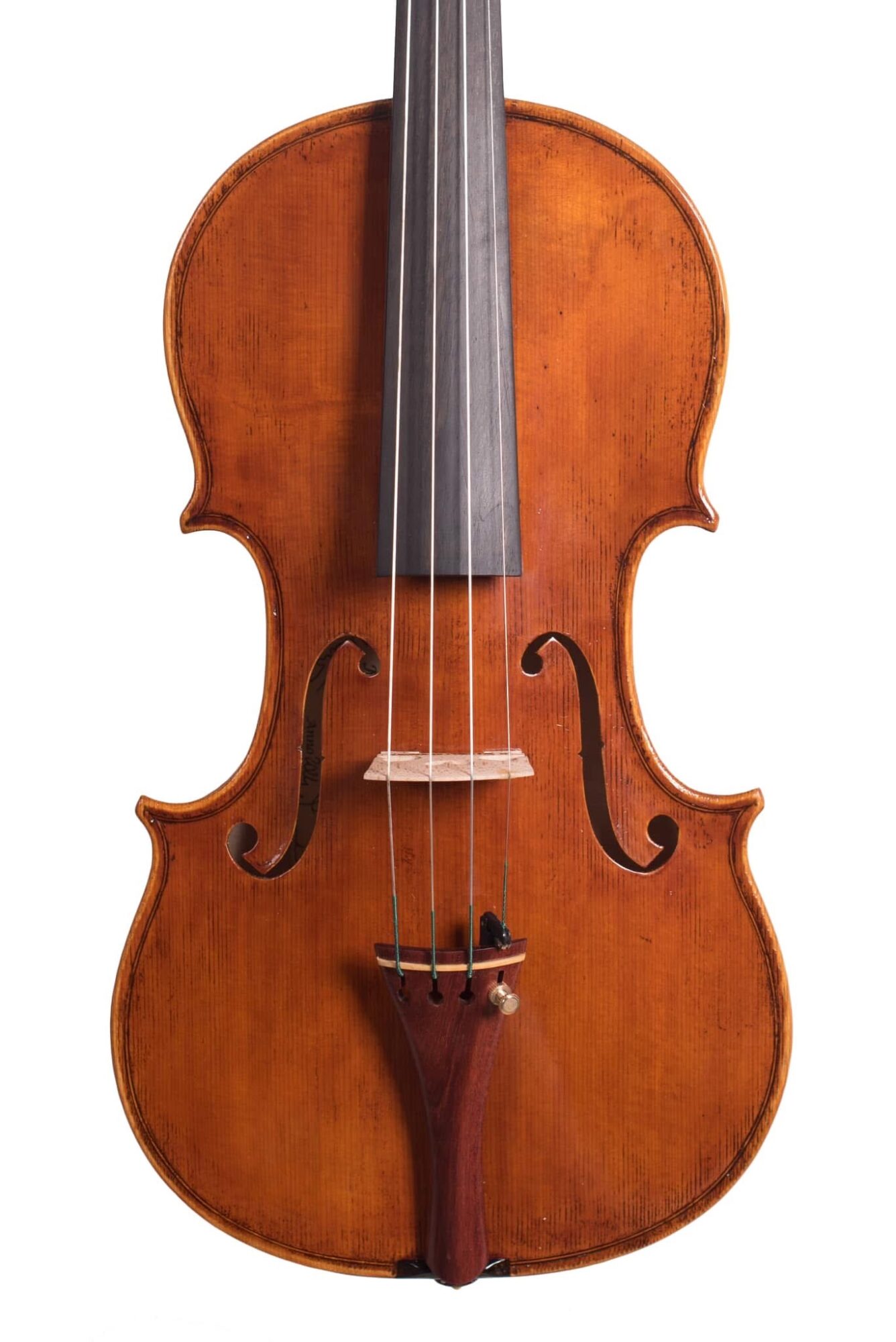 Vertical view of a wooden violin with strings, fingerboard, and f-holes visible.