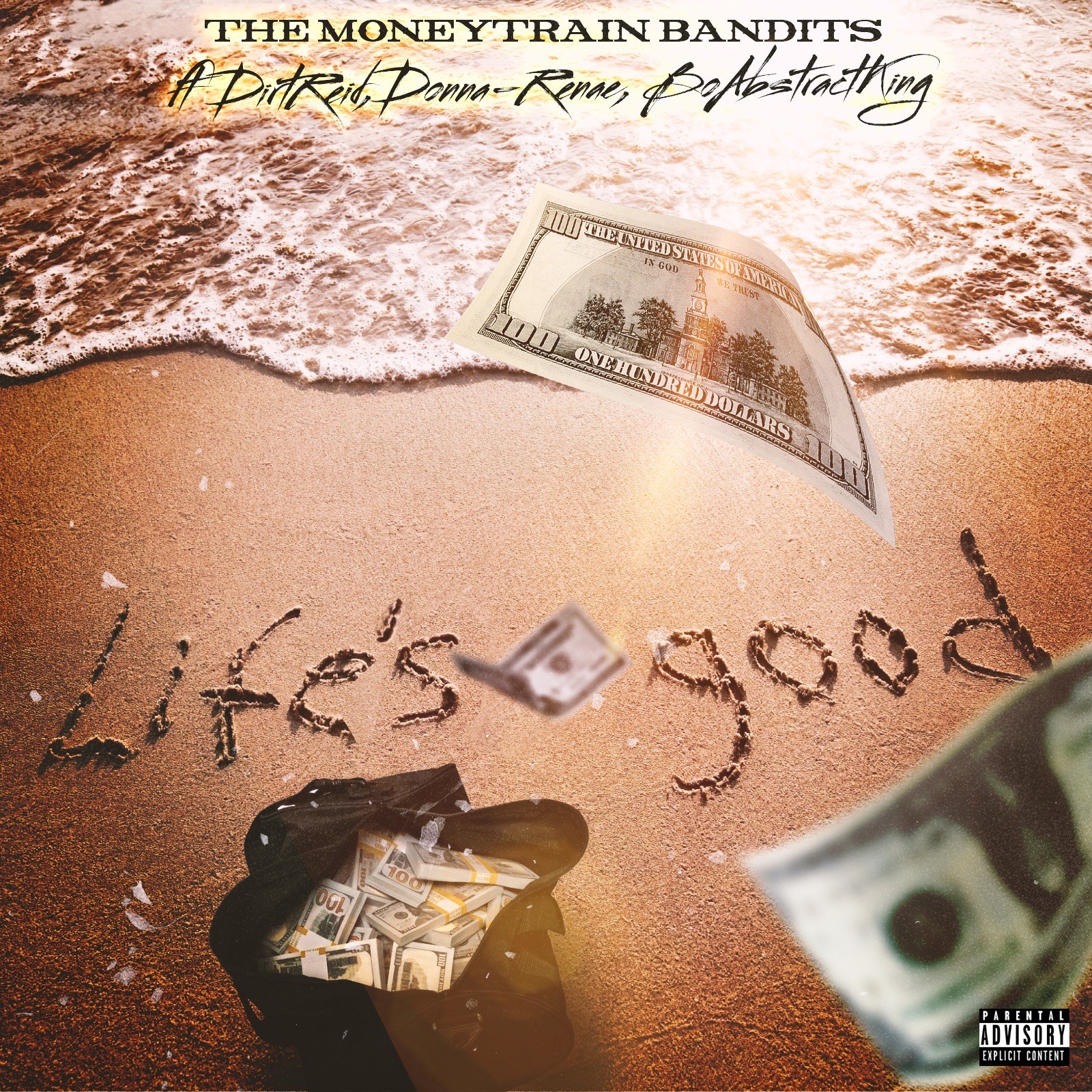 Sand with writing 'life's good' and money, including a dollar bill and a bag of cash, on the beach.