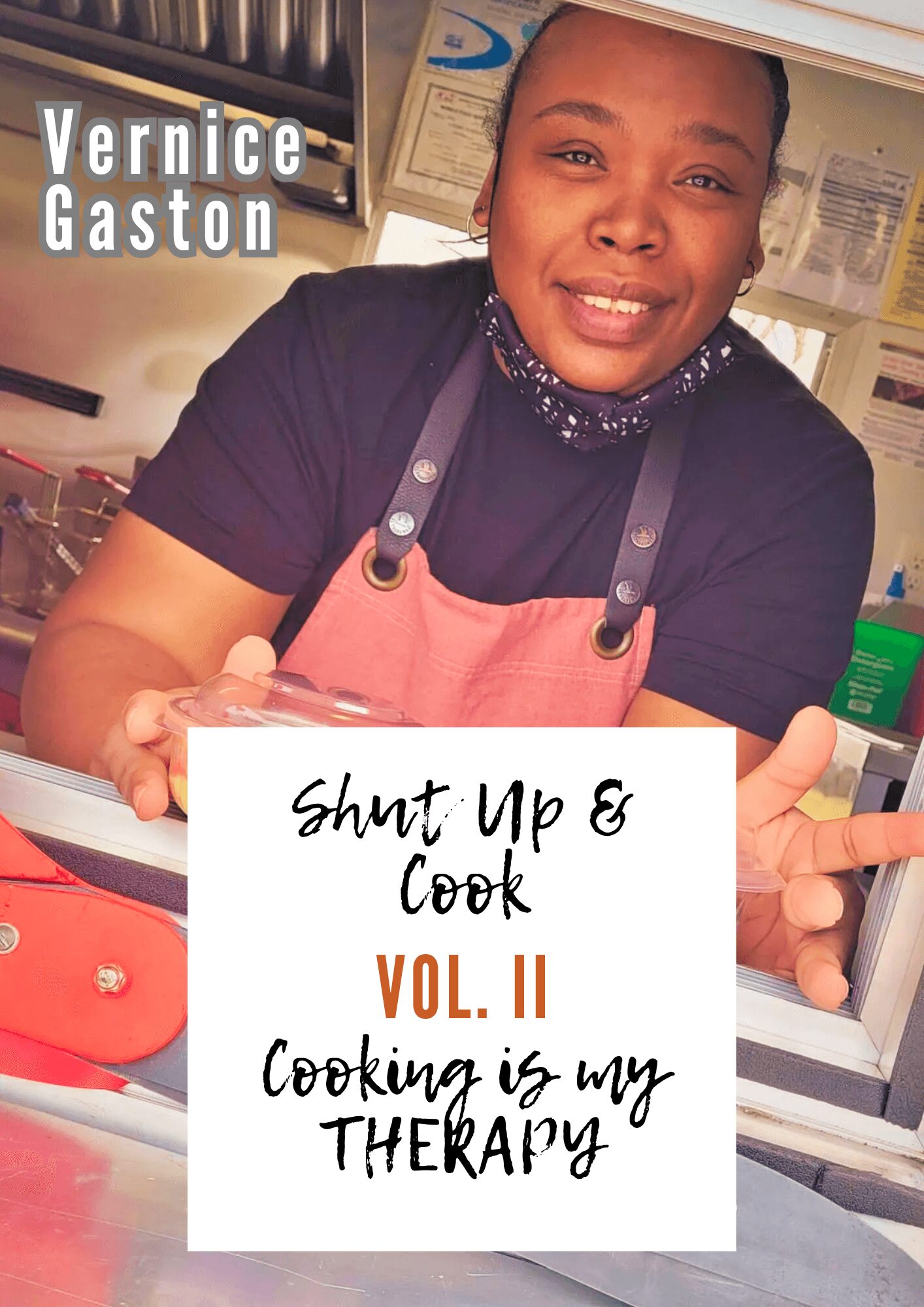 Woman smiling behind a counter with a sign reading 'Shut Up & Cook VOL. II Cooking is my THERAPY'.