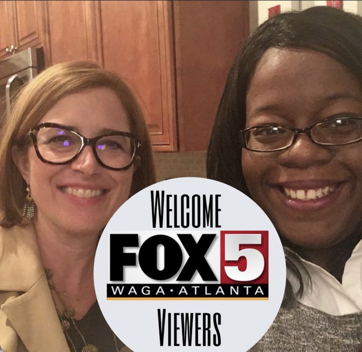Two women smiling, one with glasses and blonde hair, the other with glasses and dark hair, with a FOX 5 logo overlay.