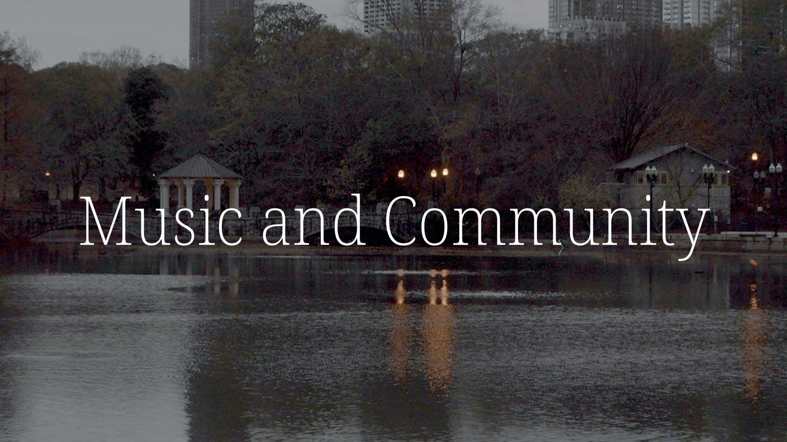 Text overlay reading 'Music and Community' over a lake with trees and buildings in the background.
