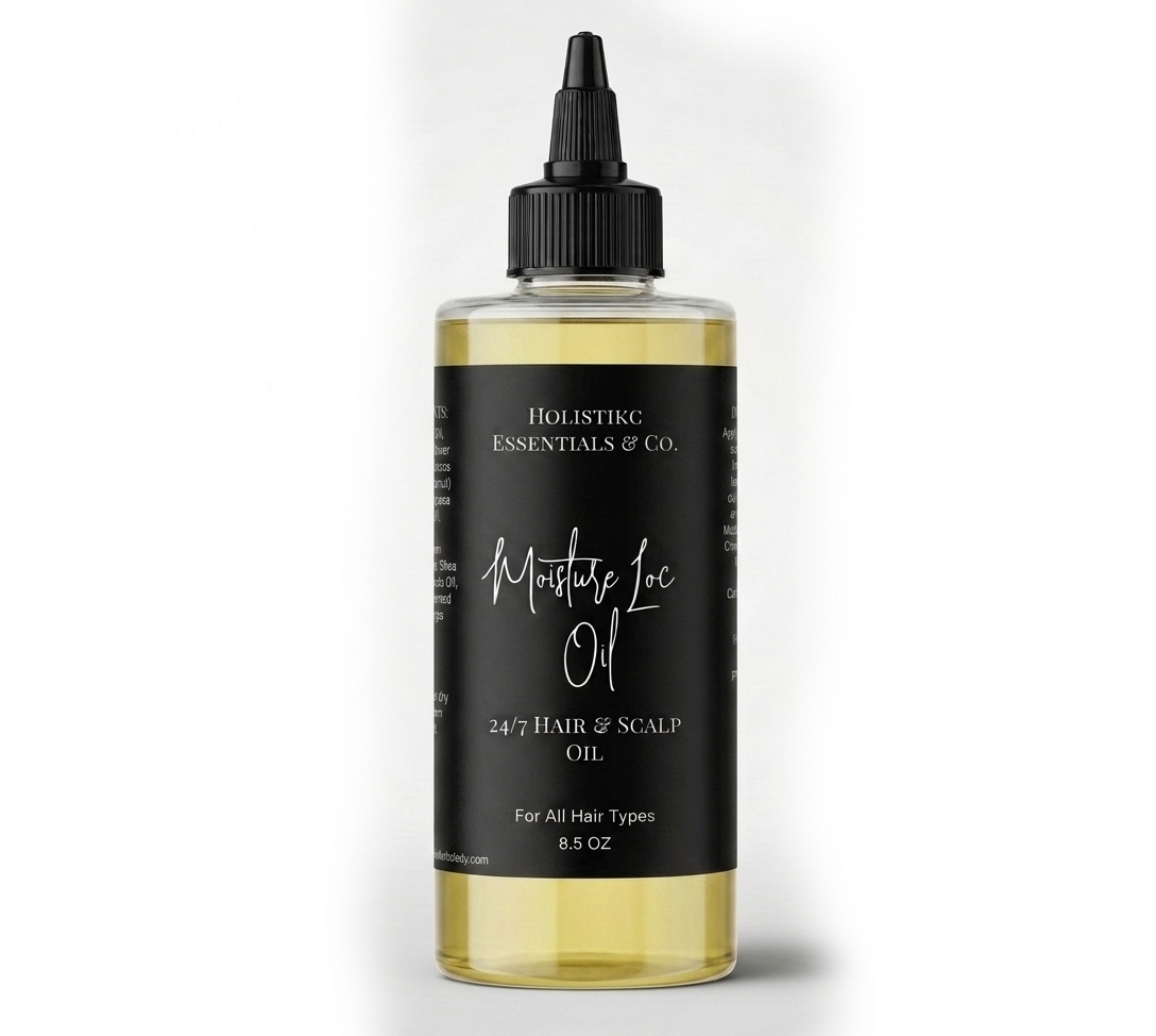 Bottle of scalp oil with black label and yellow liquid inside, labeled 'Holistic Essentials of Co' and 'Montague Inc.'