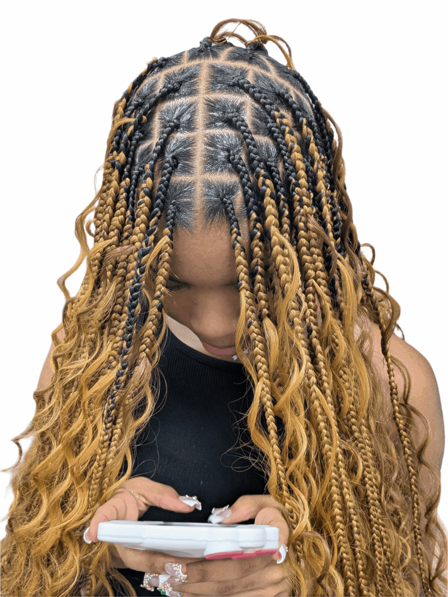 Person with blonde twisted braids looking at a phone, head tilted downward, top view, black sleeveless top