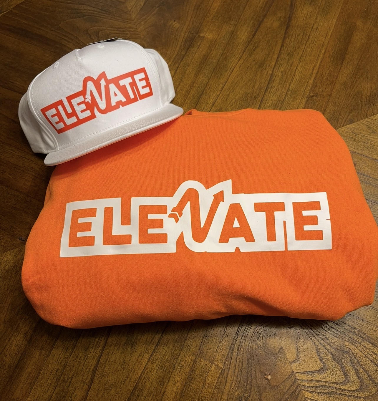 White cap and orange cloth with