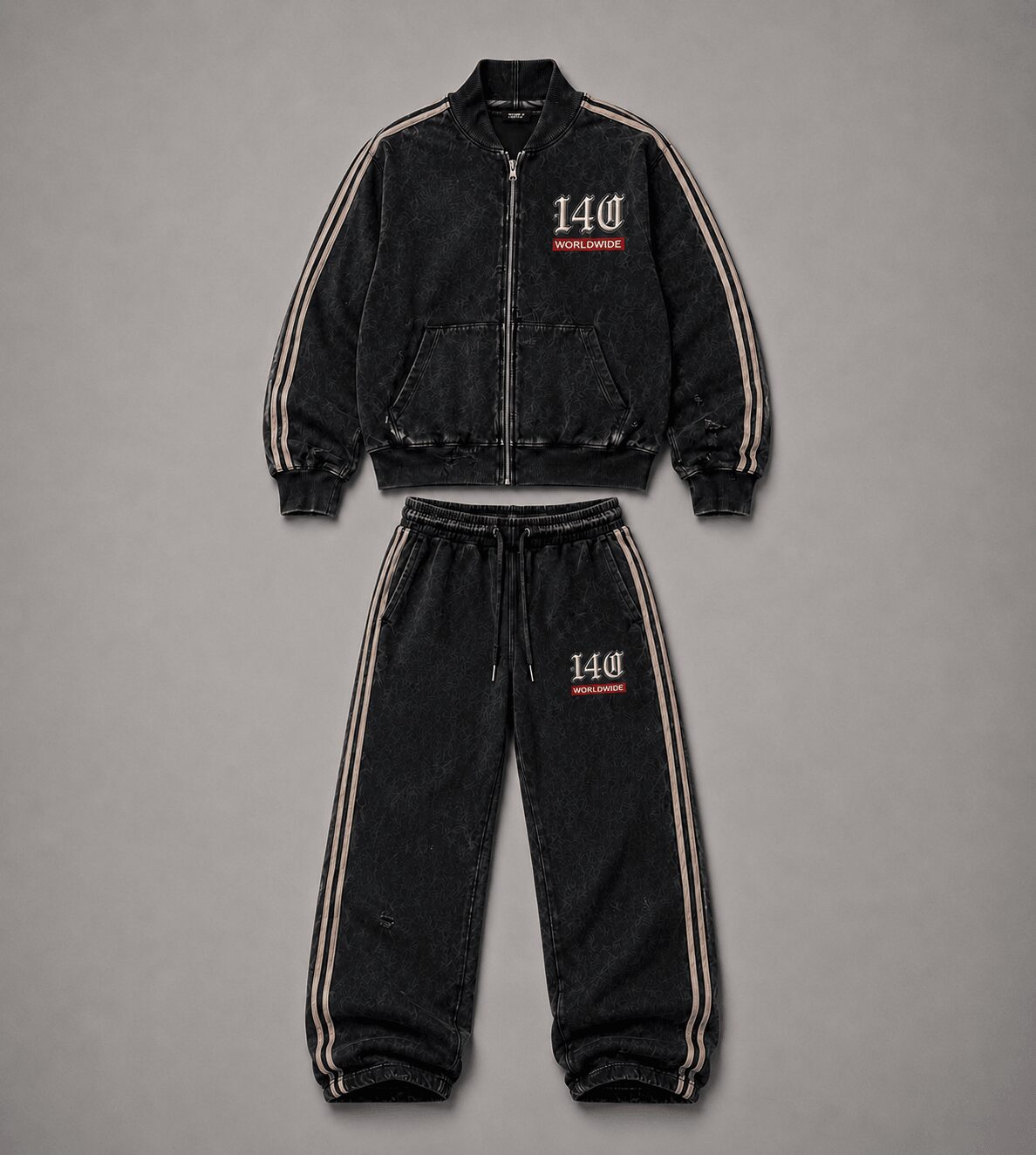 Black tracksuit with striped sides, jacket and pants, featuring the number 140 and red text, laid flat on gray background.
