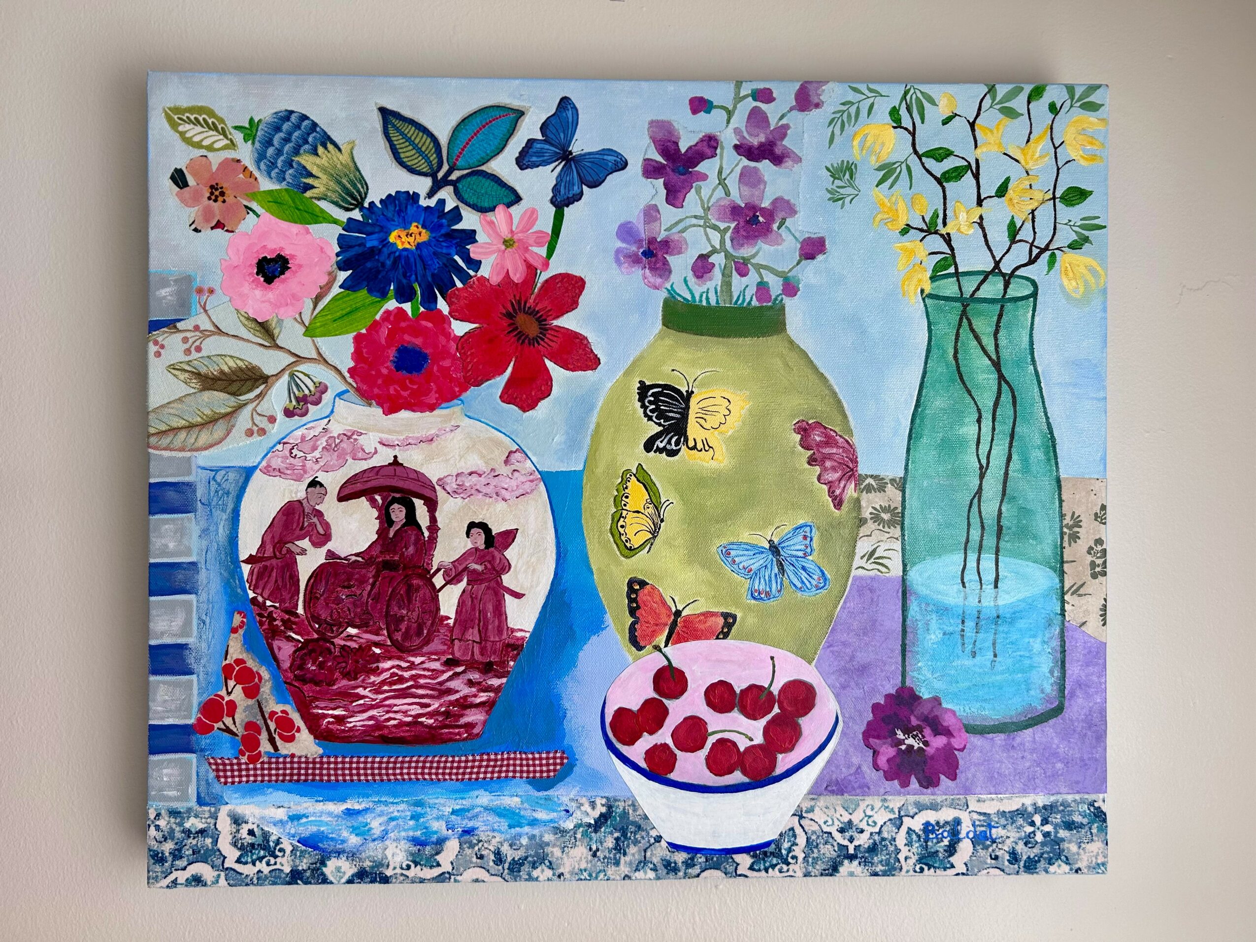 Colorful still life with flowers in vases, a bowl of cherries, and decorative items on a table.