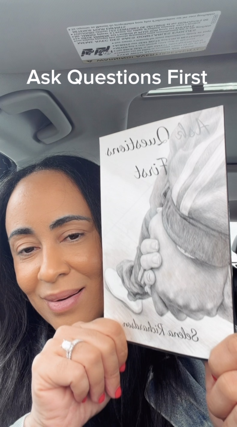Woman holding a pamphlet with a handshake illustration, smiling, inside a car, with text saying 'Ask Questions First'.