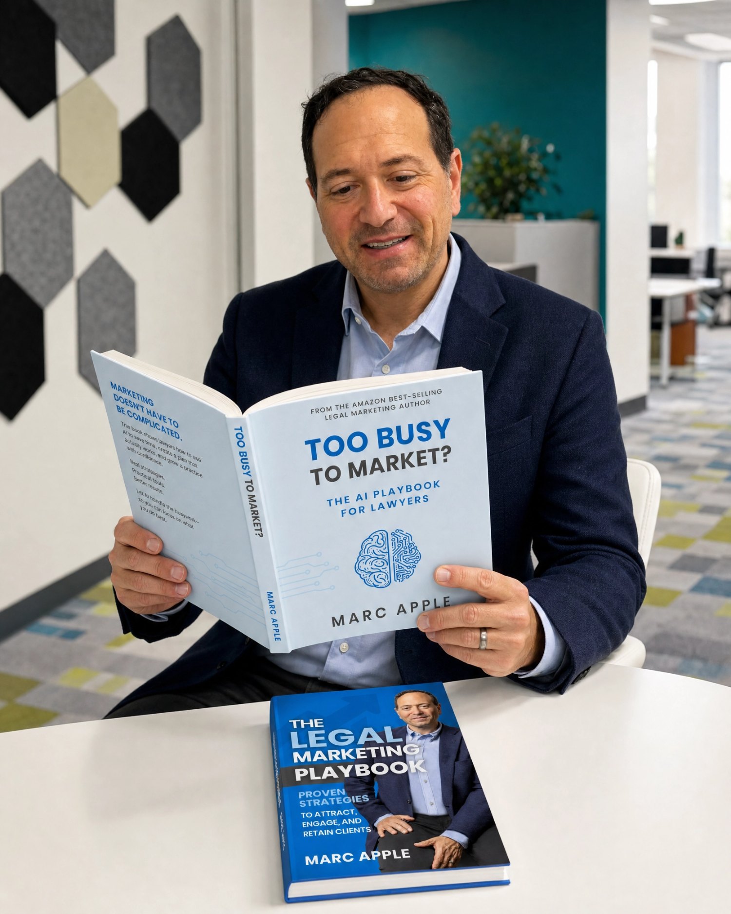 Man in suit reading a book titled 'Too Busy to Market?' in a modern office space.