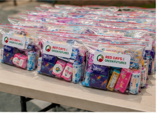 Multiple clear plastic bags filled with small toys and items, labeled 'Red Days Green Futures,' displayed on a table.