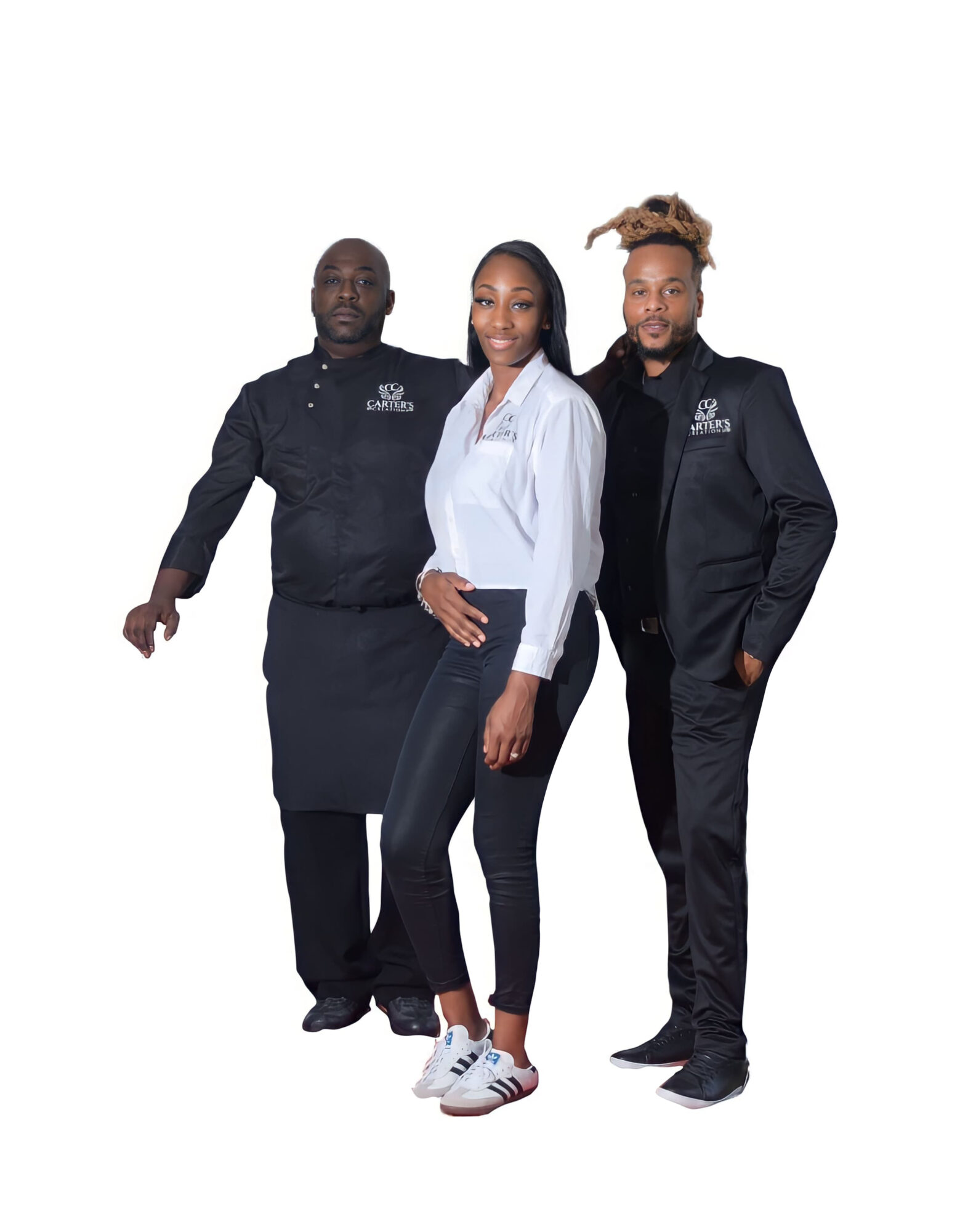 Three people standing together, two men and one woman, all dressed in professional attire, smiling at the camera.
