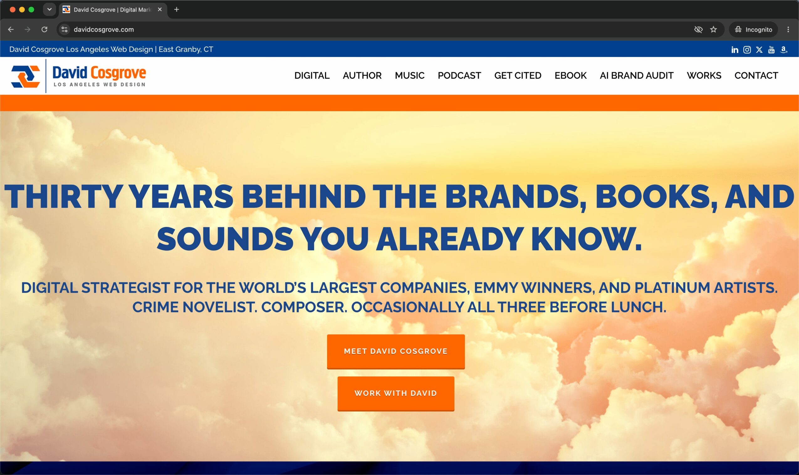 Website homepage with a sky background, orange and blue text, and navigation menu at the top.