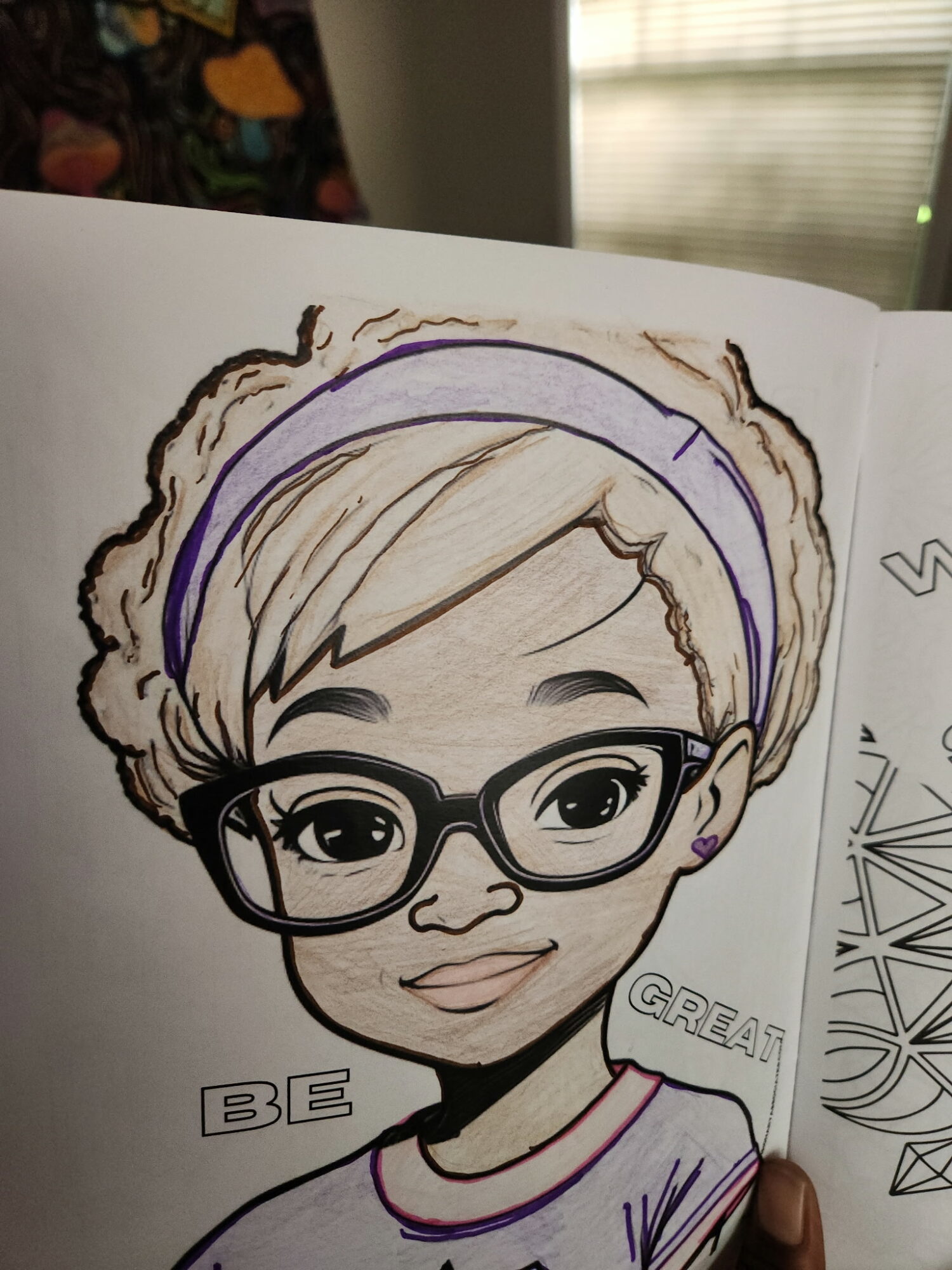 Hand-drawn portrait of a person with glasses, short hair, and a headband, smiling, with text 'BE GREAT' nearby.