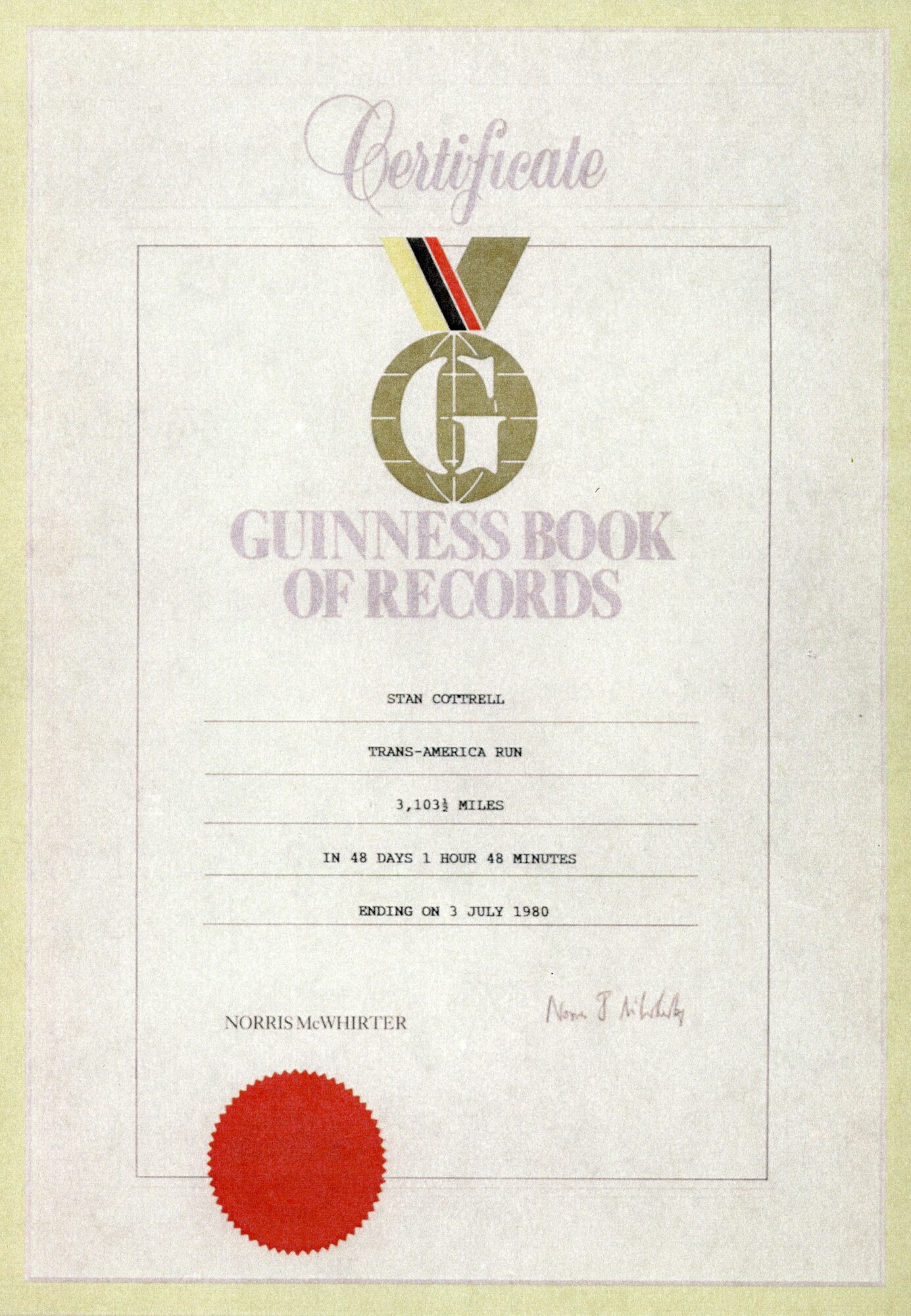 Certificate with gold emblem, red seal, and text, including Guinness Book of Records logo and signature.