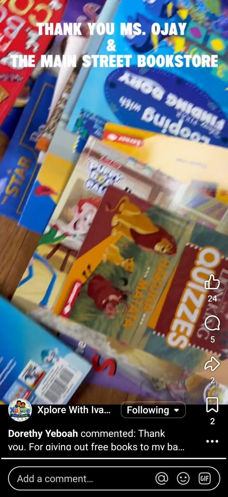 Bookshelves with colorful books and a sign reading 'Thank you Ms. Ojay' at a bookstore.