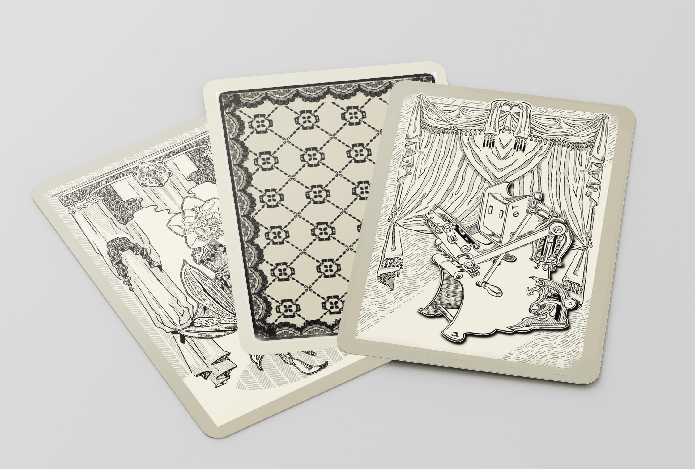 Three black-and-white illustrated cards with different patterns and scenes, overlapping each other, on a light background.