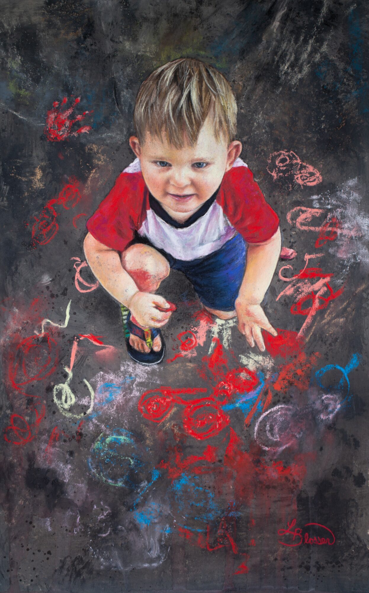 Young boy with short hair, wearing a red and white shirt, crouching on a chalkboard with colorful chalk drawings.
