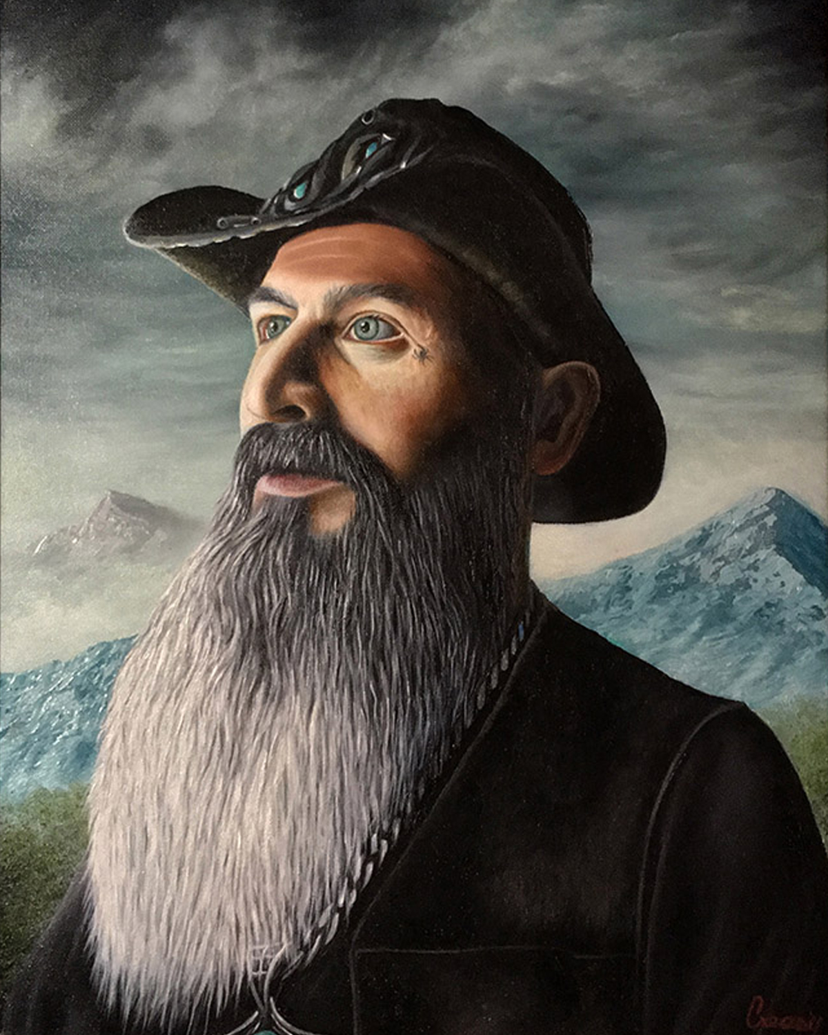 Portrait of a man with a long gray beard wearing a hat with a snake on top, set against mountains and cloudy sky.