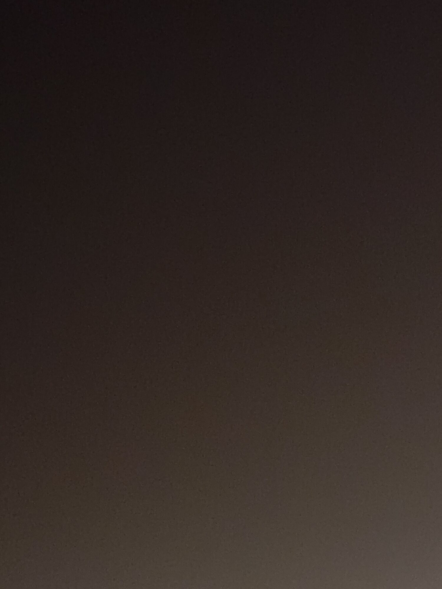 Dark, blurry image with no distinguishable objects or details.