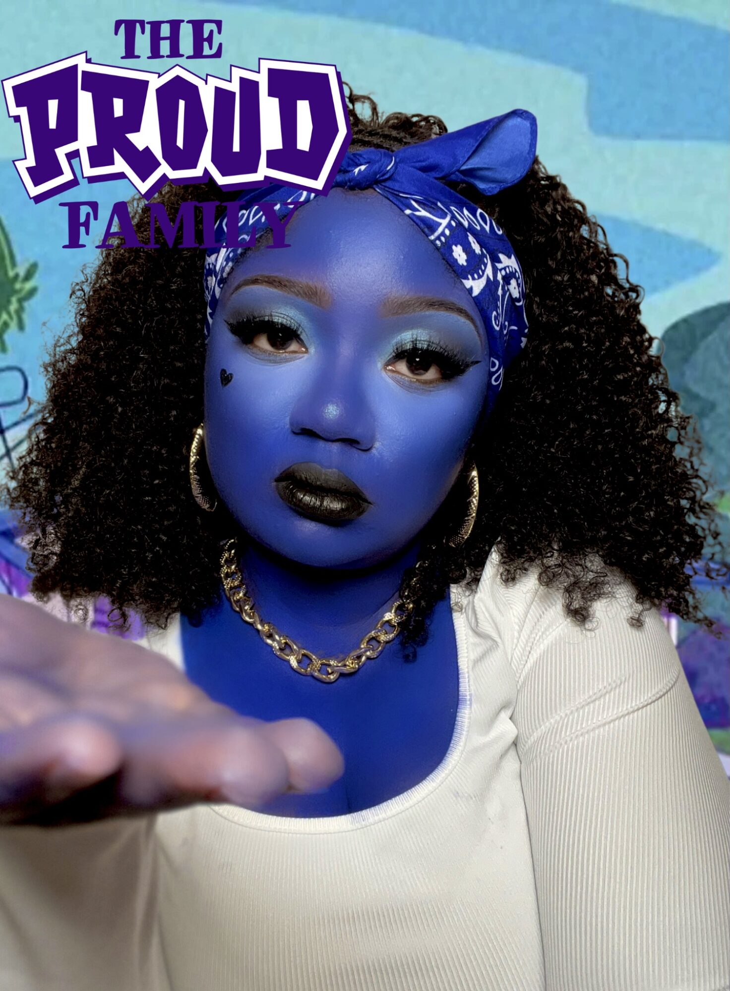 Woman with blue face paint, curly hair, blue bandana, gold jewelry, reaching out, colorful background, text overlay.