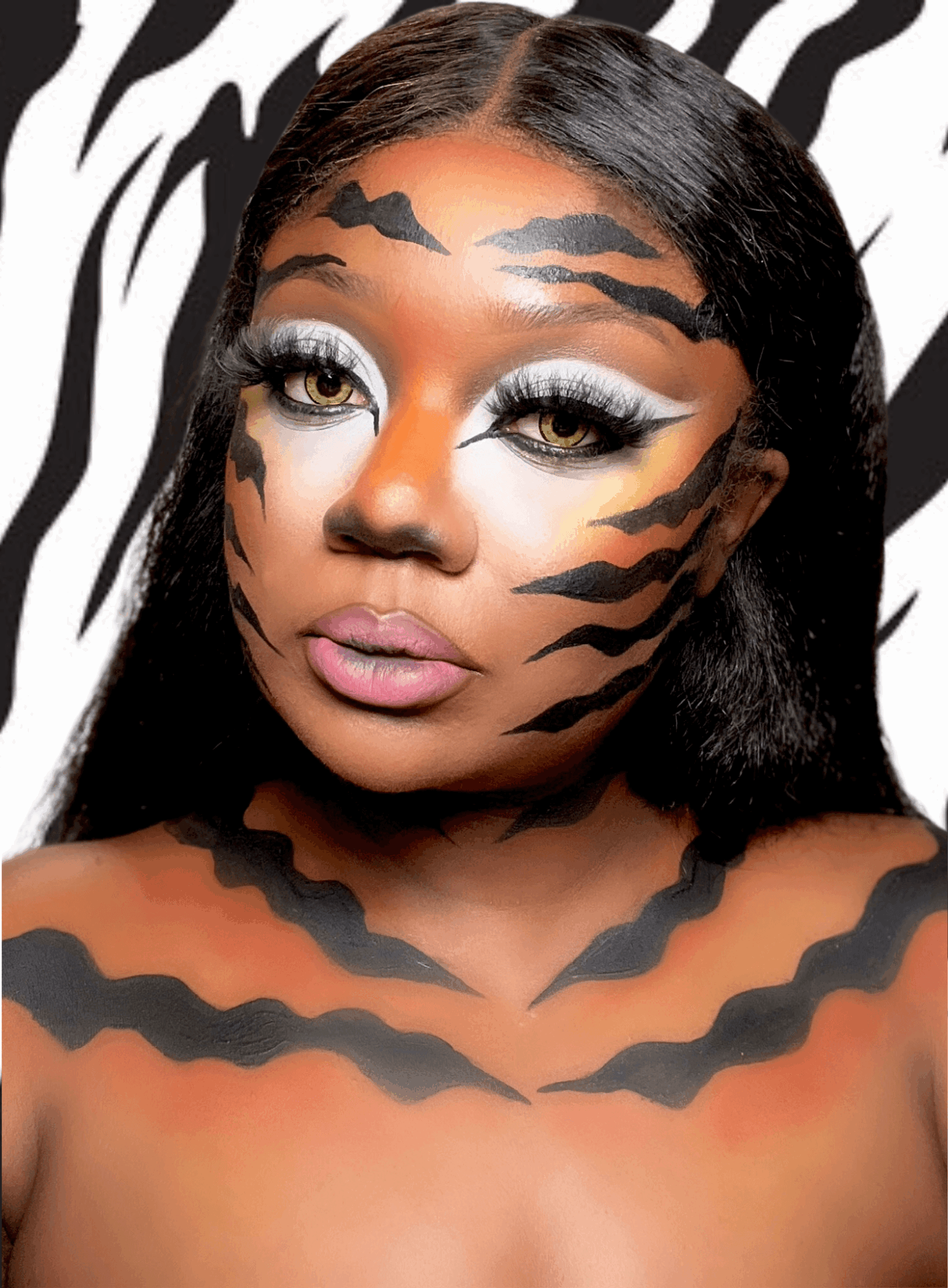 Woman with tiger stripe face makeup, long black hair, and a zebra-striped background.