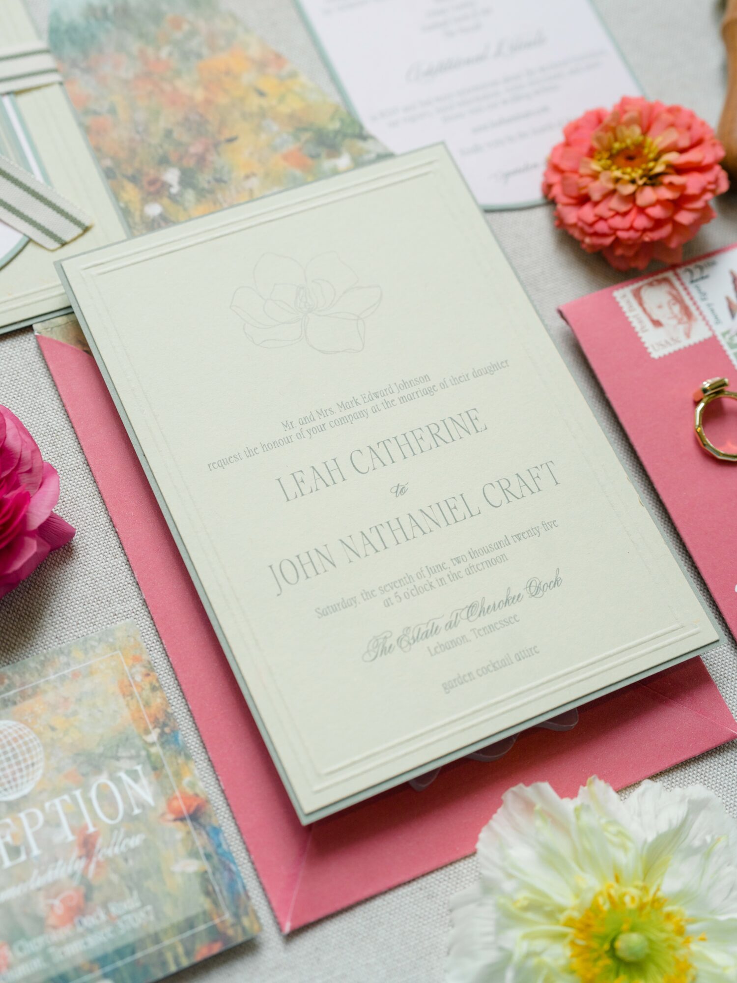 Wedding invitation with floral decorations, pink and white flowers, and a pink background.