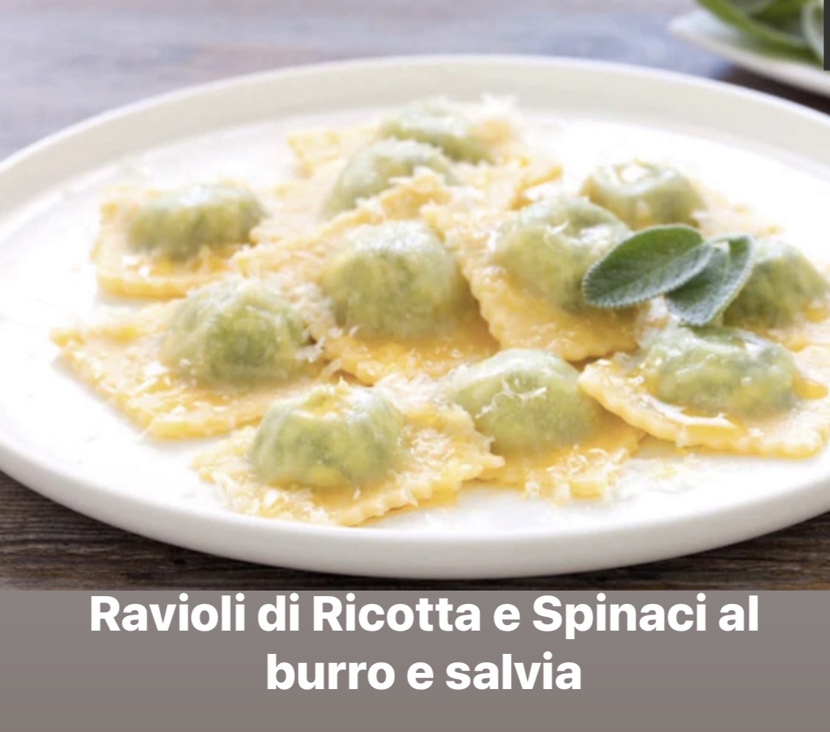 Plate of ricotta and spinach ravioli with butter and sage, garnished with grated cheese, on a white dish.